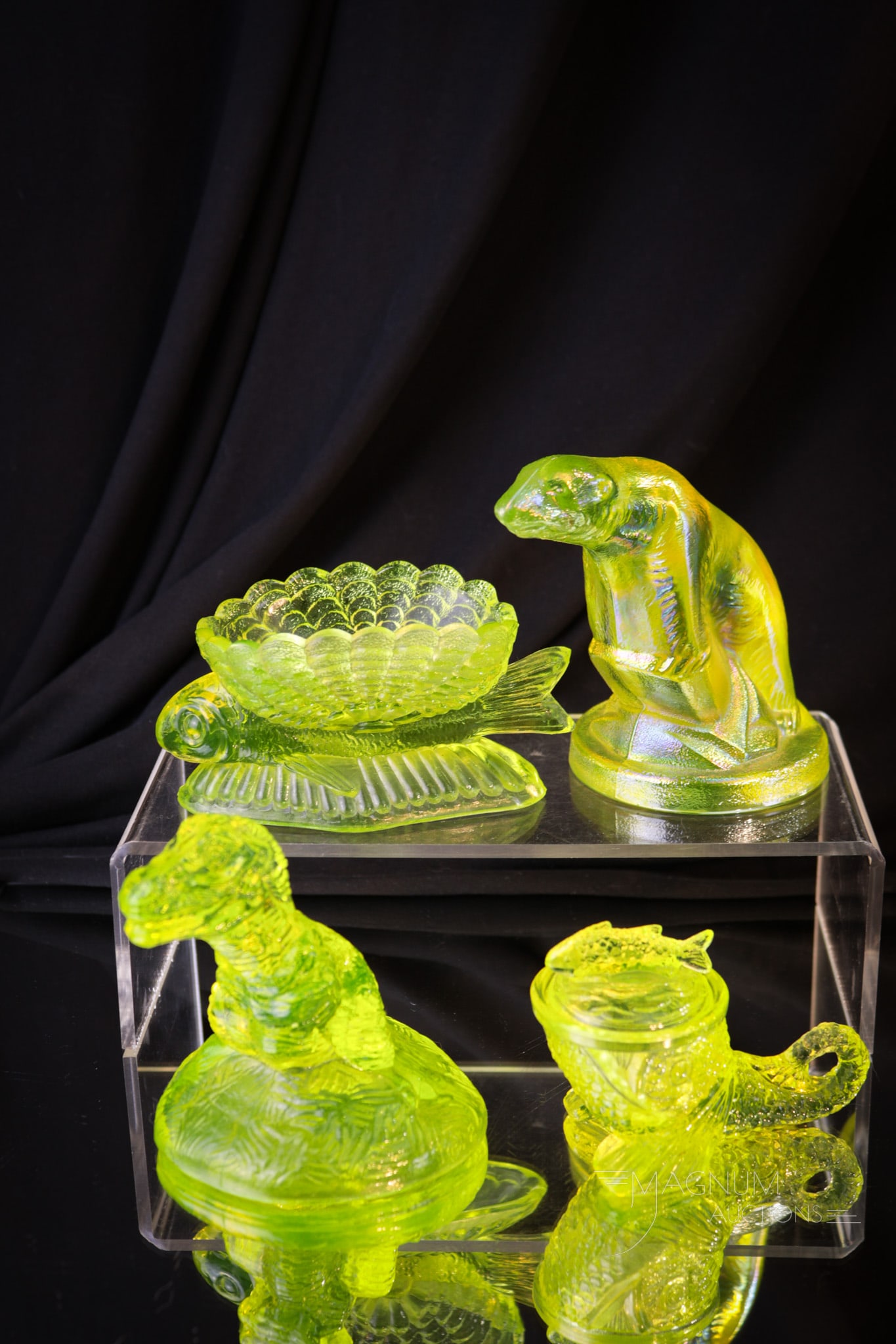 4 pc Lot Vaseline Glass L.G. Wright & Boyd Figurals: Four fun finds in vaseline glass by L.G. Wright and Boyd. This lot includes a T-Rex, a polar bear, a dolphin, and a fish figurine. Tallest measures 4"