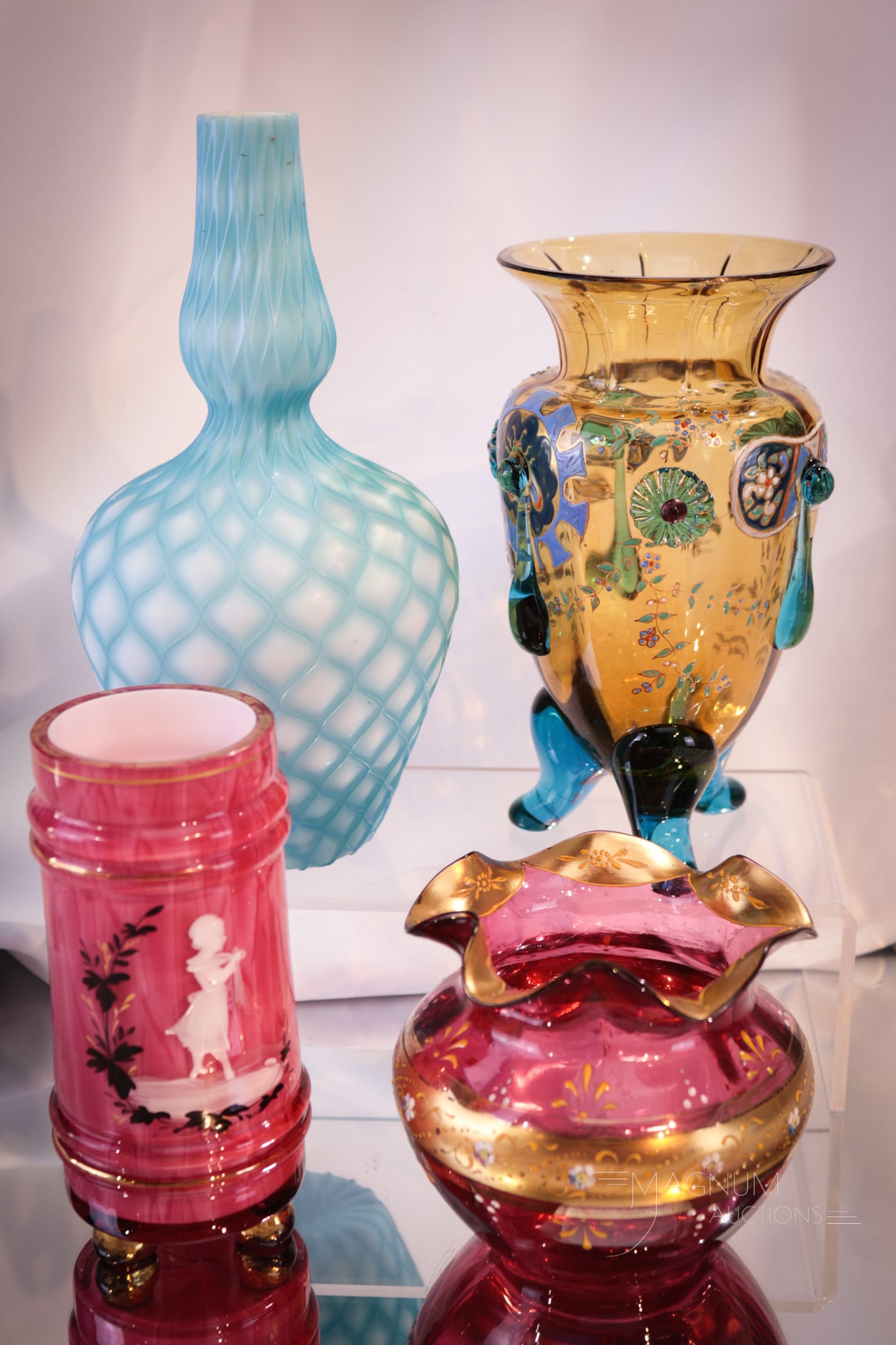 4 pc Lot Victorian Art Glass Mary Gregory Cut Velvet Bohemian & More: Four selections to entice you. Included in this lot is a Mary Gregory decorated vase, a cranberry enameled vase, a cut velvet vase and a blue & amber enameled glass Bohemian example vase. Tallest meas