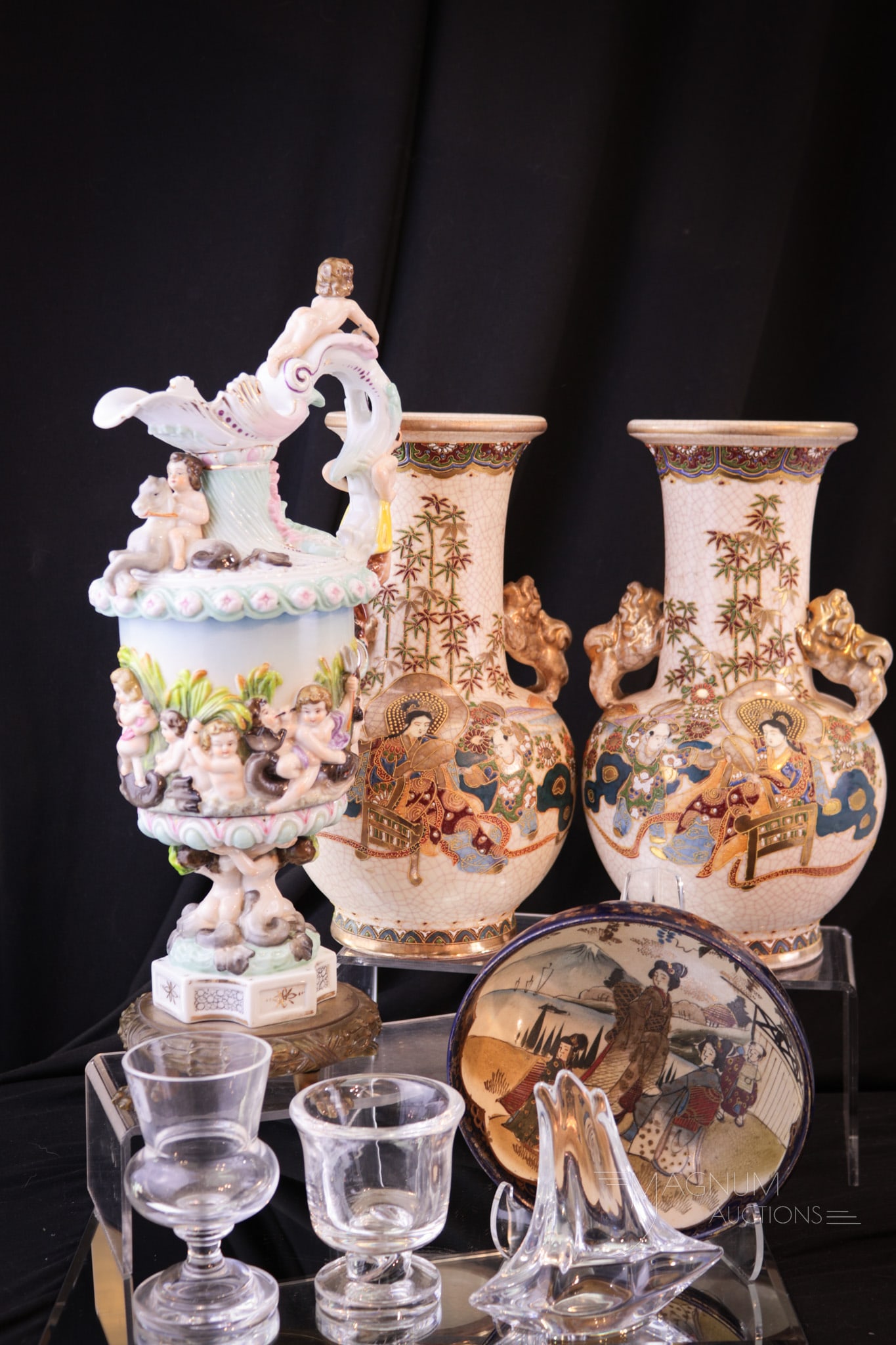 Mother Magnum's Lot of Plenty Satsuma Capodimante Steuben Porcelain & Crystal Daum: Mother Magnum's lot of plenty. This lot has so much to offer and yet.. This lot includes Satsuma style and Capodimante porcelain along with Steuben crystal items, as well as a Daum France sailboat. Ta