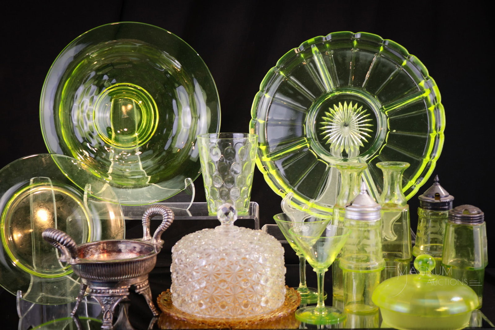 14 pc Mega Magnum Auctions Lot "Generosity in Vaseline Glass": A Mega Magnum Auction lot of fourteen pieces of vaseline related pieces and parts. This lot is mainly made up of vaseline glass condiment bottles and more. Tallest measures 5".