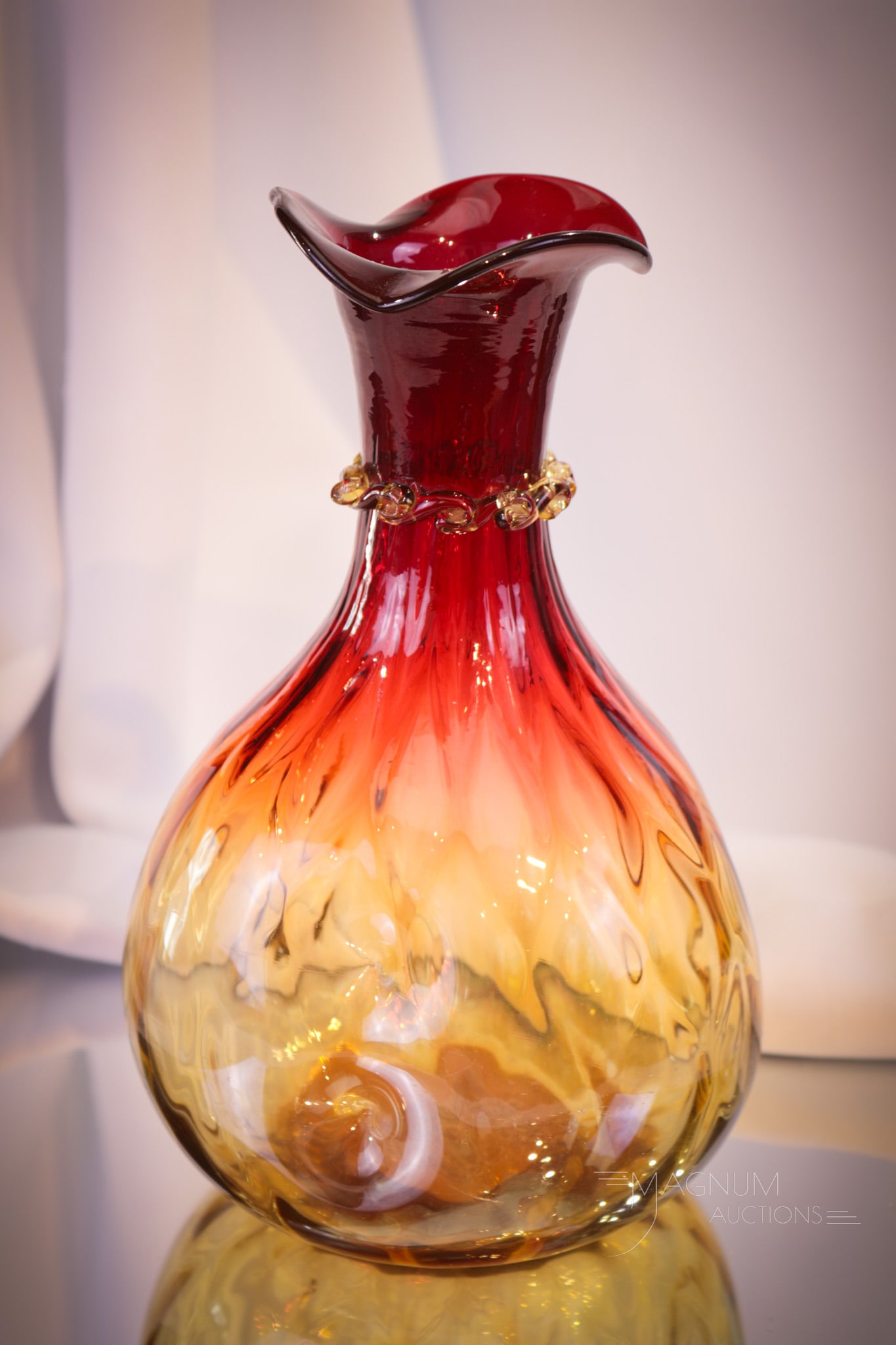 Mt. Washington Victorian Amberina Glass Diamond Quilt Caraffe: Gorgeous Victorian Mt. Washington amberina glass diamond quilt body caraffe. Piece has the added decoration of applied rigaree. Measures 8 1/2" tall. Provenance: From the estate of the late Bill & Bet