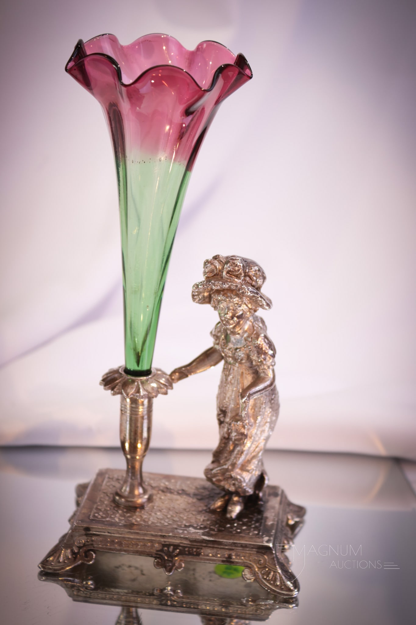 Tufts Silverplate Kate Greenaway Figural Greenarina Glass Bud Vase: A rare find folks. This fine signed Tufts silverplate holder features a Kate Greenaway girl figure next to a holder with a greenarina colored glass bud vase in it. Perfect shaded coloring of green to