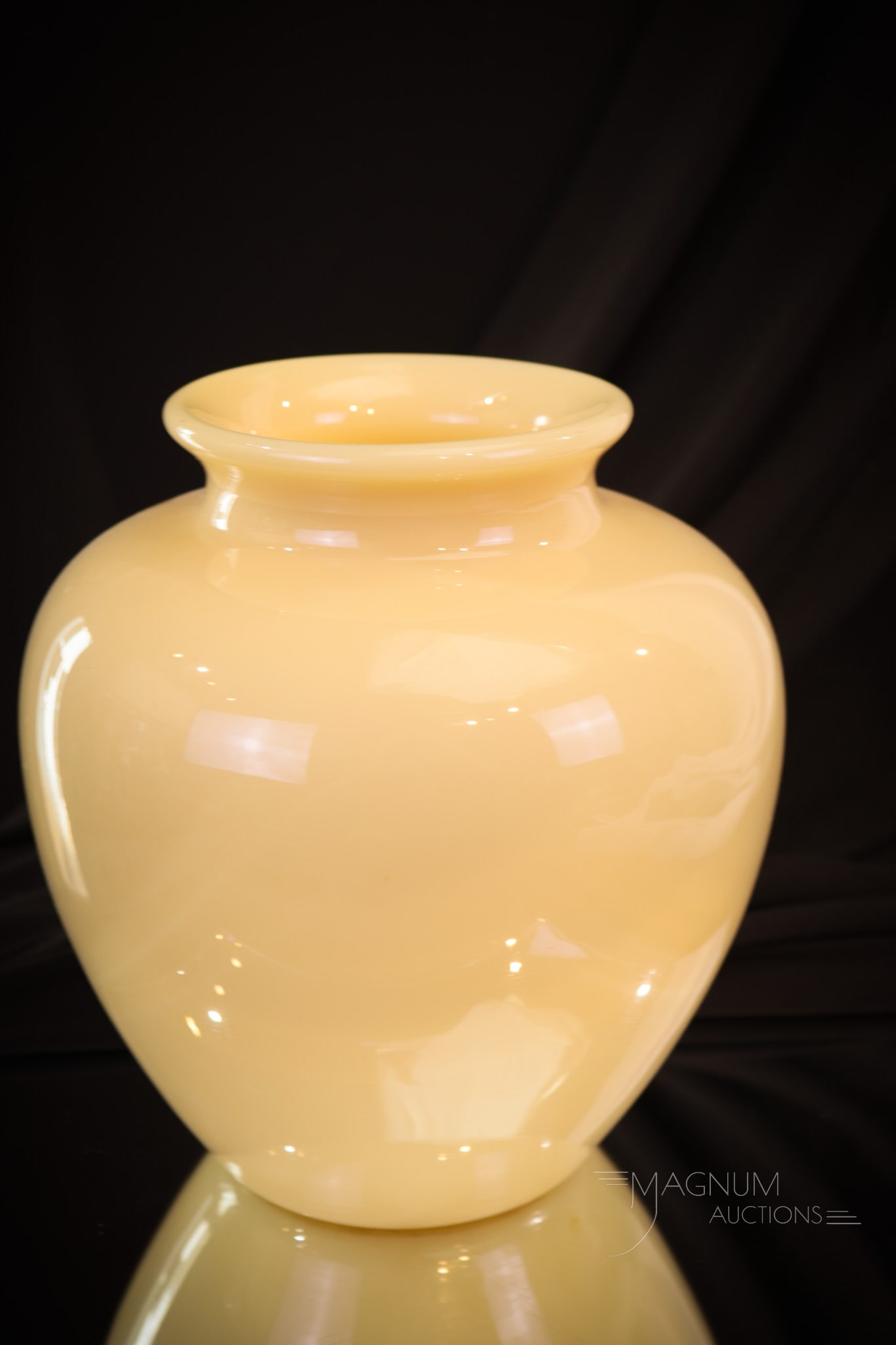 Steuben Ivory Classic Art Glass Vase: A classic find in Steuben art glass. This vase in ivory measures in at 8 1/4" tall.