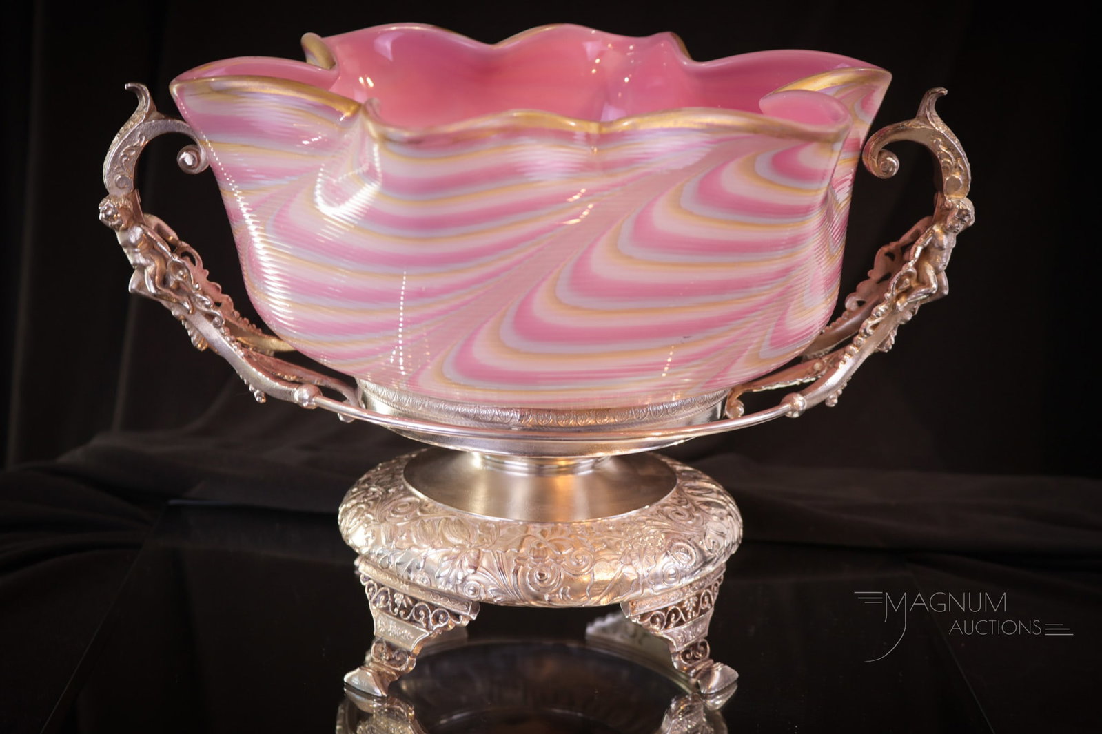 Wilcox Victorian Silverplate Rainbow Nailsea Threaded Glass Brides Bowl Centerpiece: An amazing find in our brides bowls. This bowl is threaded Nailsea glass in rainbow coloring and a pink-cased interior. It resides in the original signed, "Wilcox" holder. Holder features double nude 