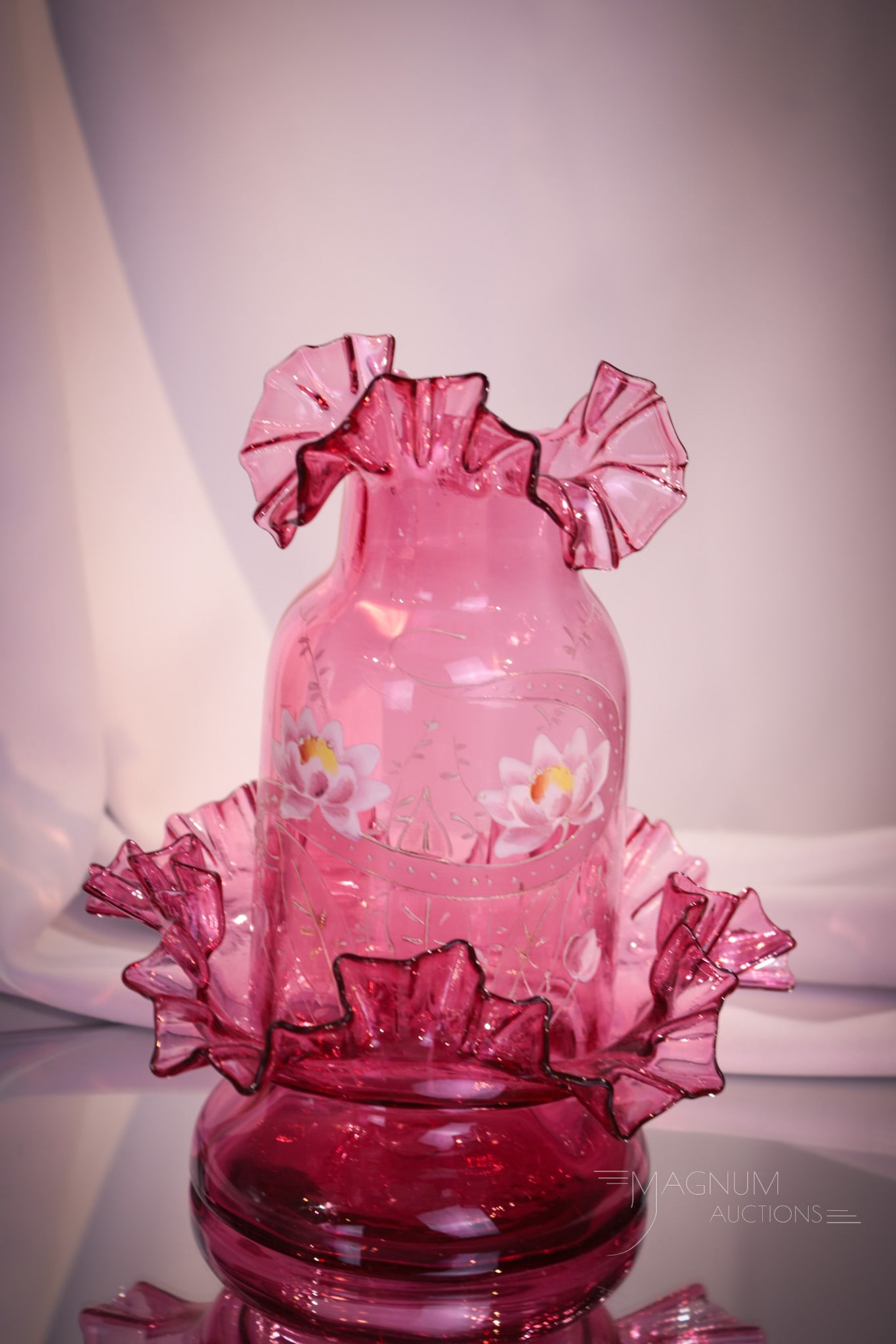 Cranberry Victorian Enameled Glass Fairy Lamp: Great cranberry enameled Victorian fairy lamp. Lamp features ruffled top and matching base with floral decoration. Measures 8" tall.
