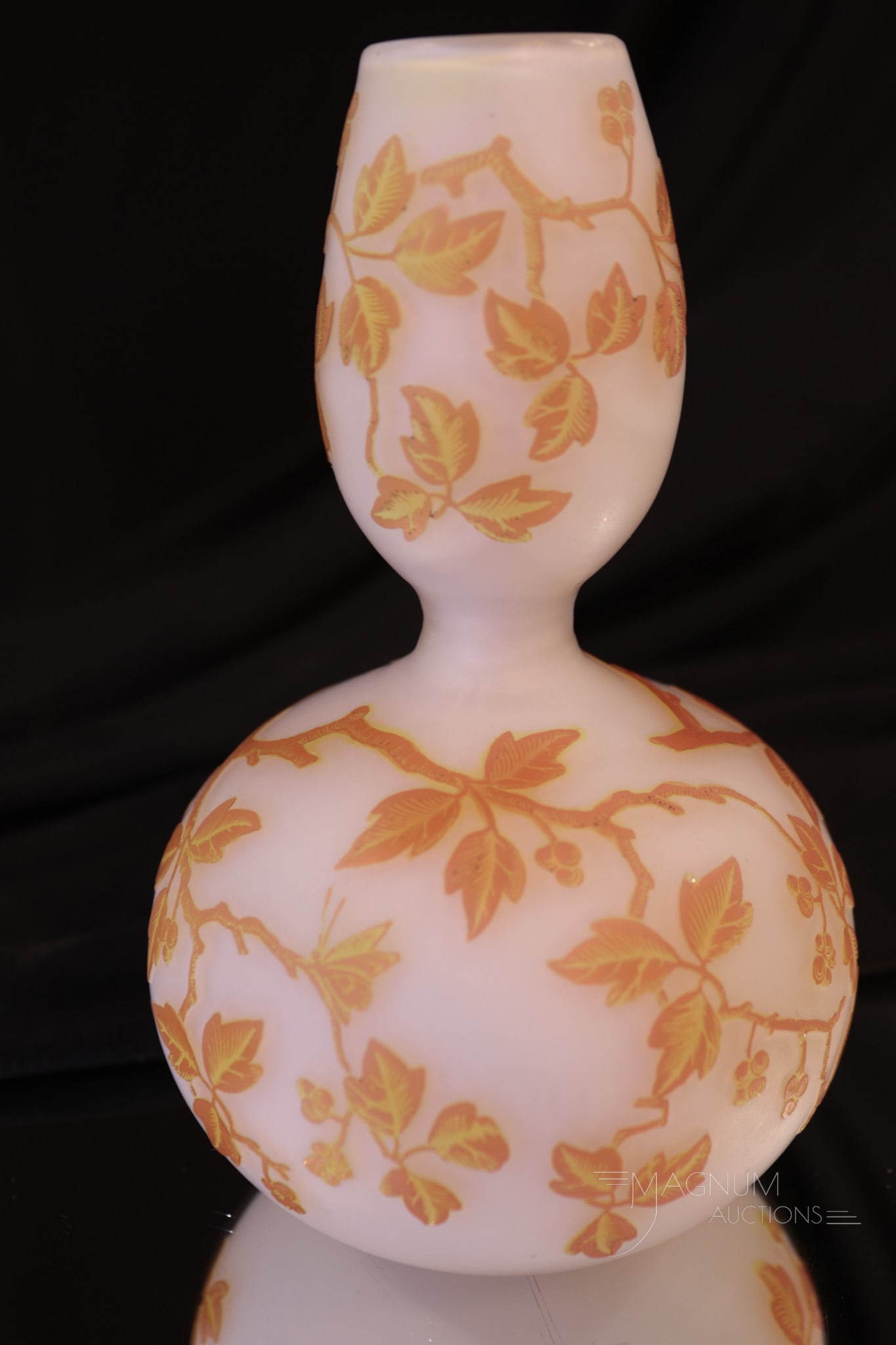 Fine Cameo Art Glass Vase: A find in our lineup of cameo glass. This piece is attributed to Weiss but is unsigned. Vase features a white ground with orange/yellow flowers and foliage. Vase measures 6" tall.