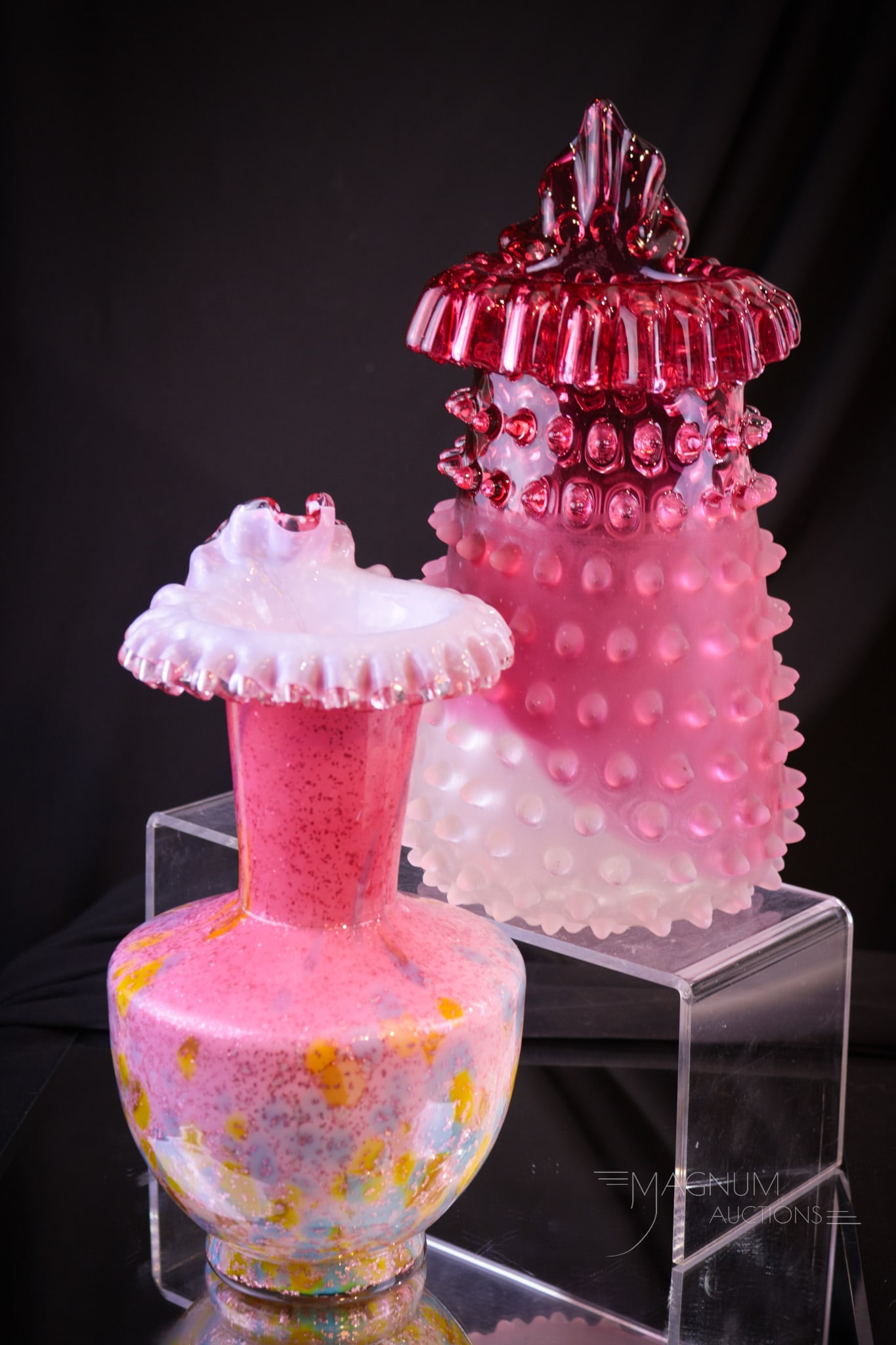 2 pc Lot Hobb's Victorian Glass Cranberry Cased Adventurine Glass Vases: Two select finds in Victorian Hobb's Glass. Two examples of Jack in the Pulpit form vases. One in cranberry rubina satin hobnail. The other in a cased mica spatter example. Tallest measures 10 1/2".