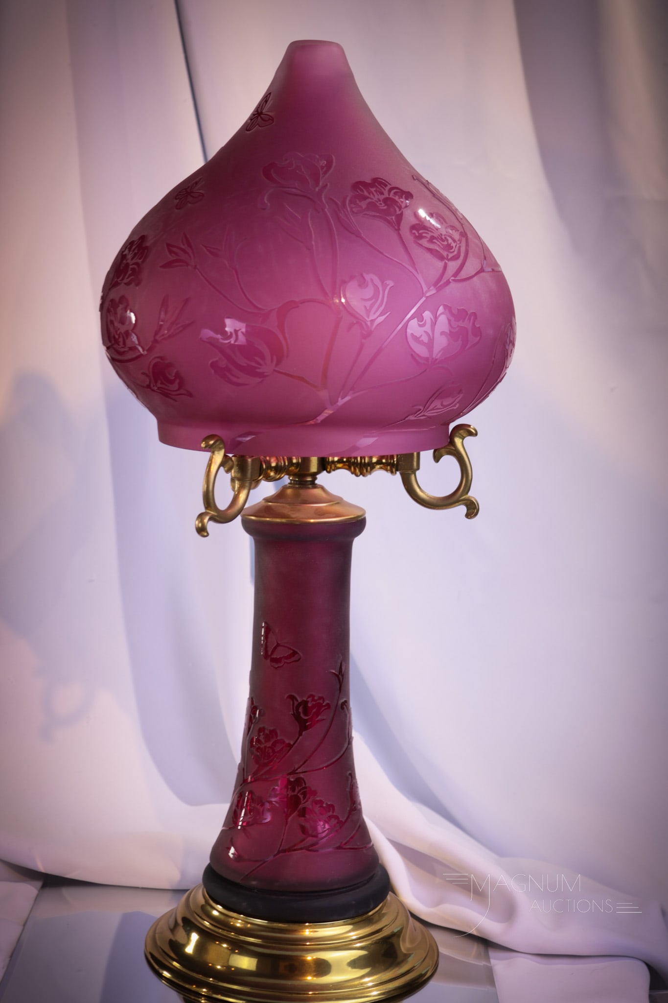 Kelsey Murphy Pilgrim Cameo Glass Flowers & Butterflies 22" Lamp: Gorgeous cranberry Kelsey Murphy Pilgrim glass sand-carved table lamp. Lamp measures 22 1/2" tall, 9" diameter. Lamp shade and base are decorated with flowers and butterflies.