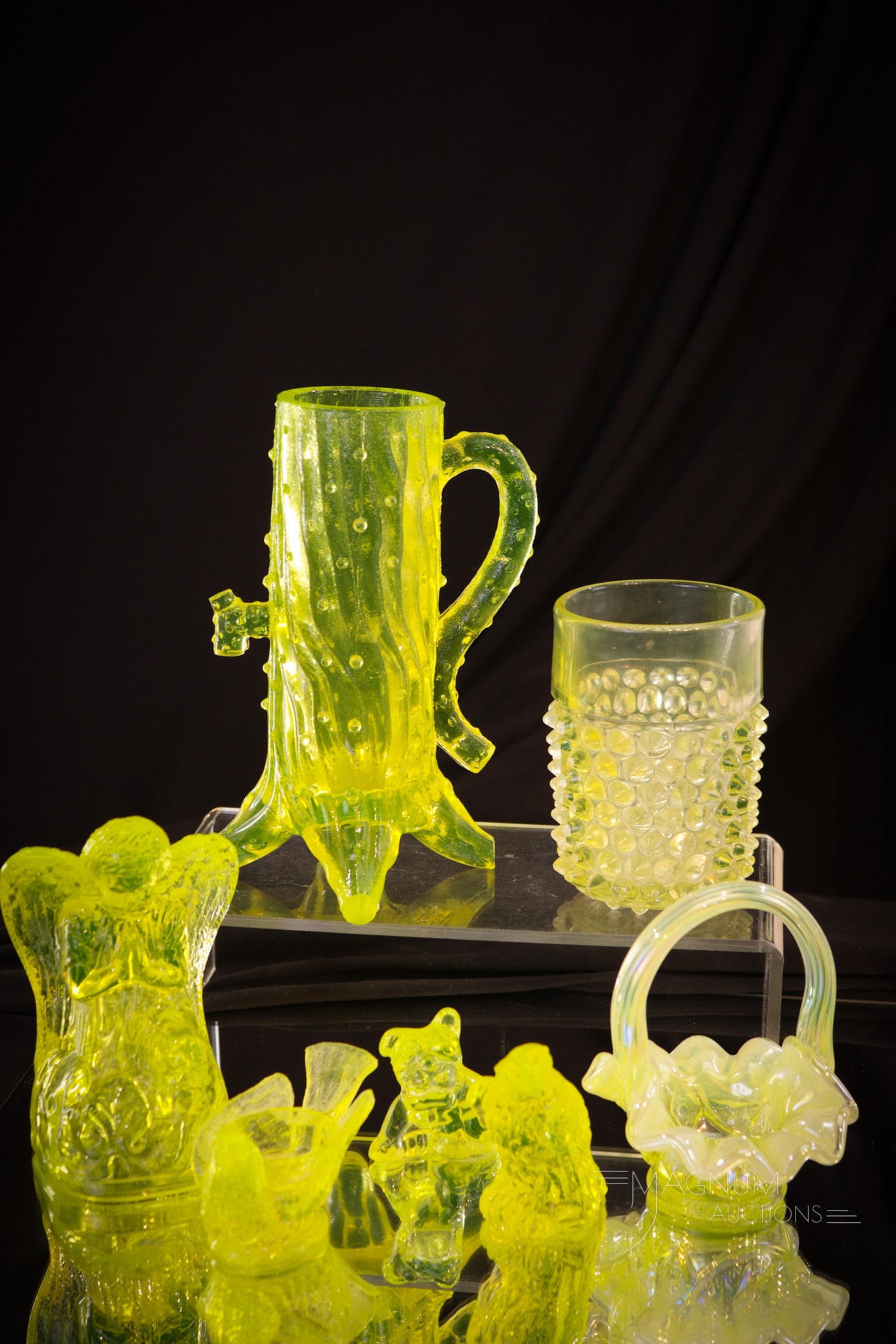 7 pc Lot "Passion for Vaseline" Glass: If you have a passion for vaseline glass then this lot's for you! Vasies stand up and take note of this seven piece lot. Lot includes a town pump, tumbler, Boyd glass eagle, bird, and pencil dog. Also