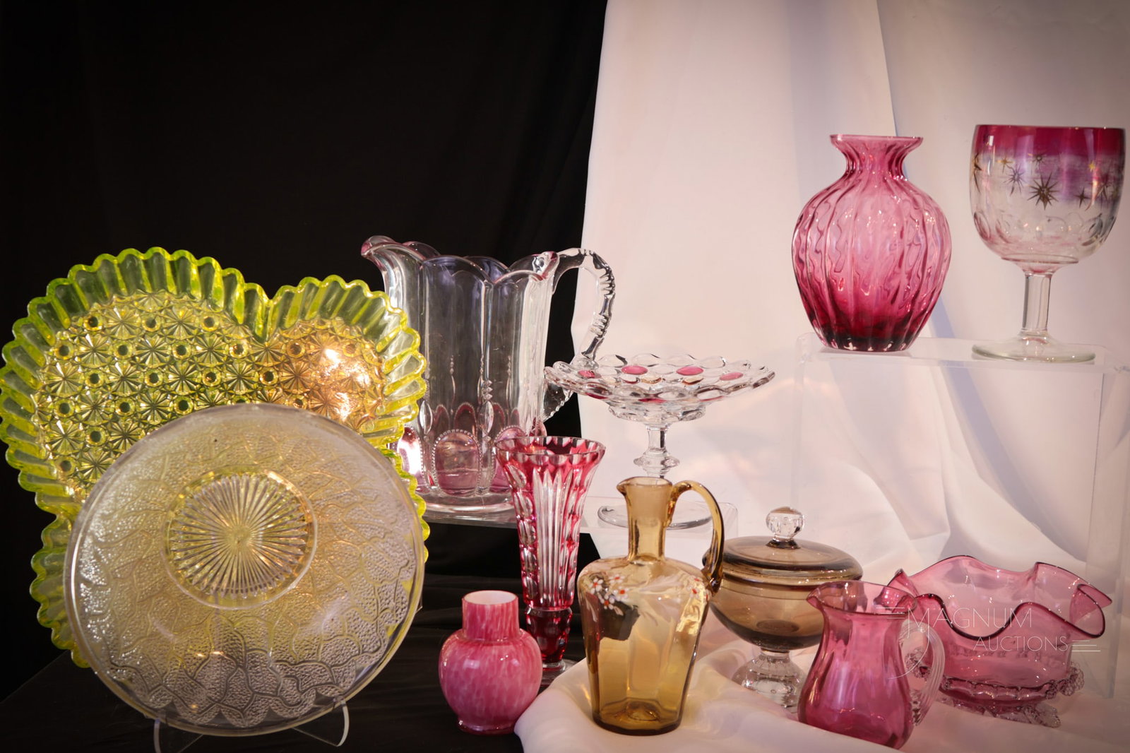 12 Magnum Auctions Cranberry Glass & More Goody Lot: A dozen fine pieces with cranberry in common in this lot. This lot is made up of some very nice and then pieces. Tallest measures 7".