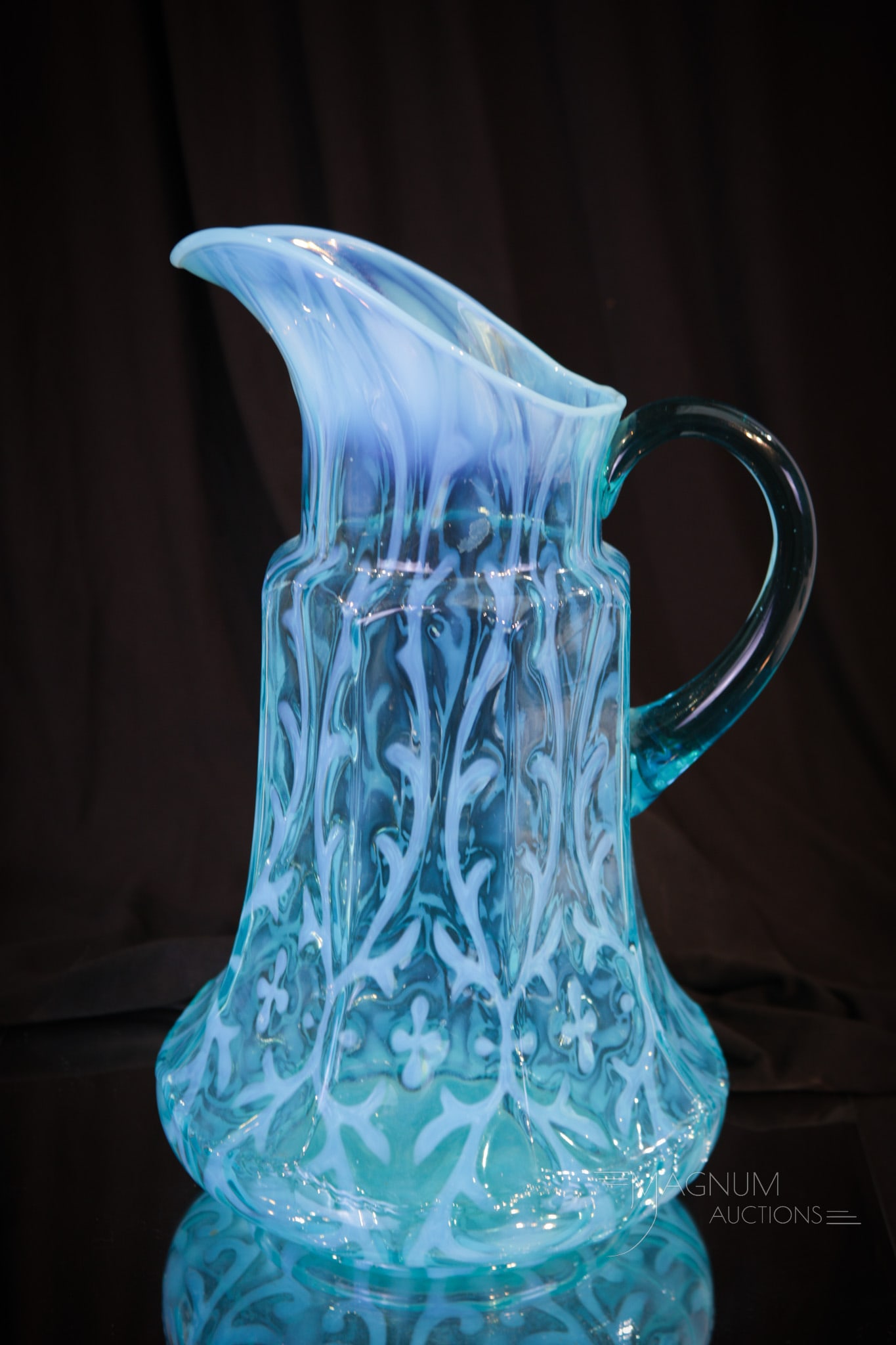 Northwood Blue Opalescent Spanish Lace Victorian Glass 9-Panel Tankard Pitcher: Gorgeous find in this Northwood blue opalescent 9-Panel mold Victorian tankard pitcher. This pitcher is a tough find for any collector. Great color and opal makes this a must have piece. Pitcher measu