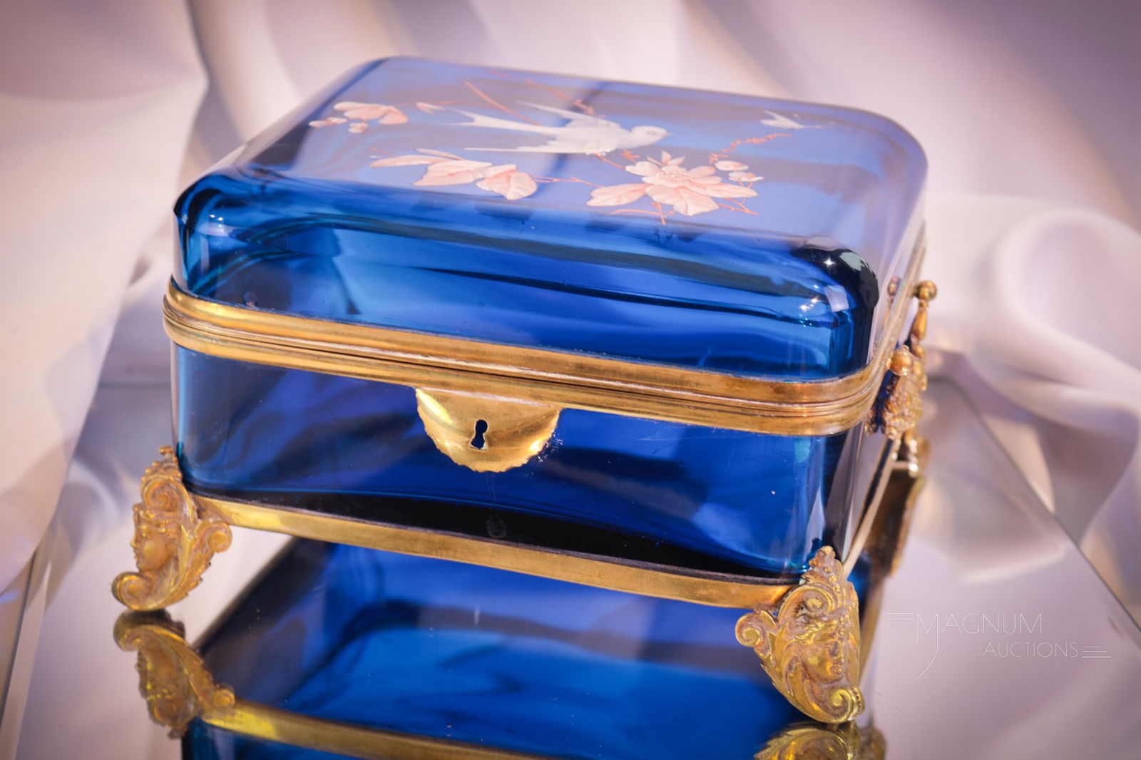 Moser Prussian Blue Enameled Victorian Large Jewelry casket: How splendid is this super Moser Prussian blue gilt and enameled jewelry casket. This large offering measures 5" tall, 7 1/2" long. This piece is complete with decorative bronze mountings. Casket is r
