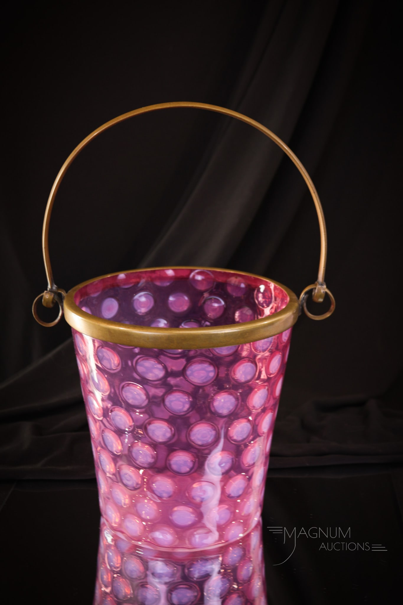 Rare Cranberry Opalescent Glass Coinspot Victorian Ice Bucket: A rare find indeed! This rich cranberry ice bucket retains the original mountings and handle. Strong opal coinpsots around adorn this great example. This piece measures 6 3/4" tall.