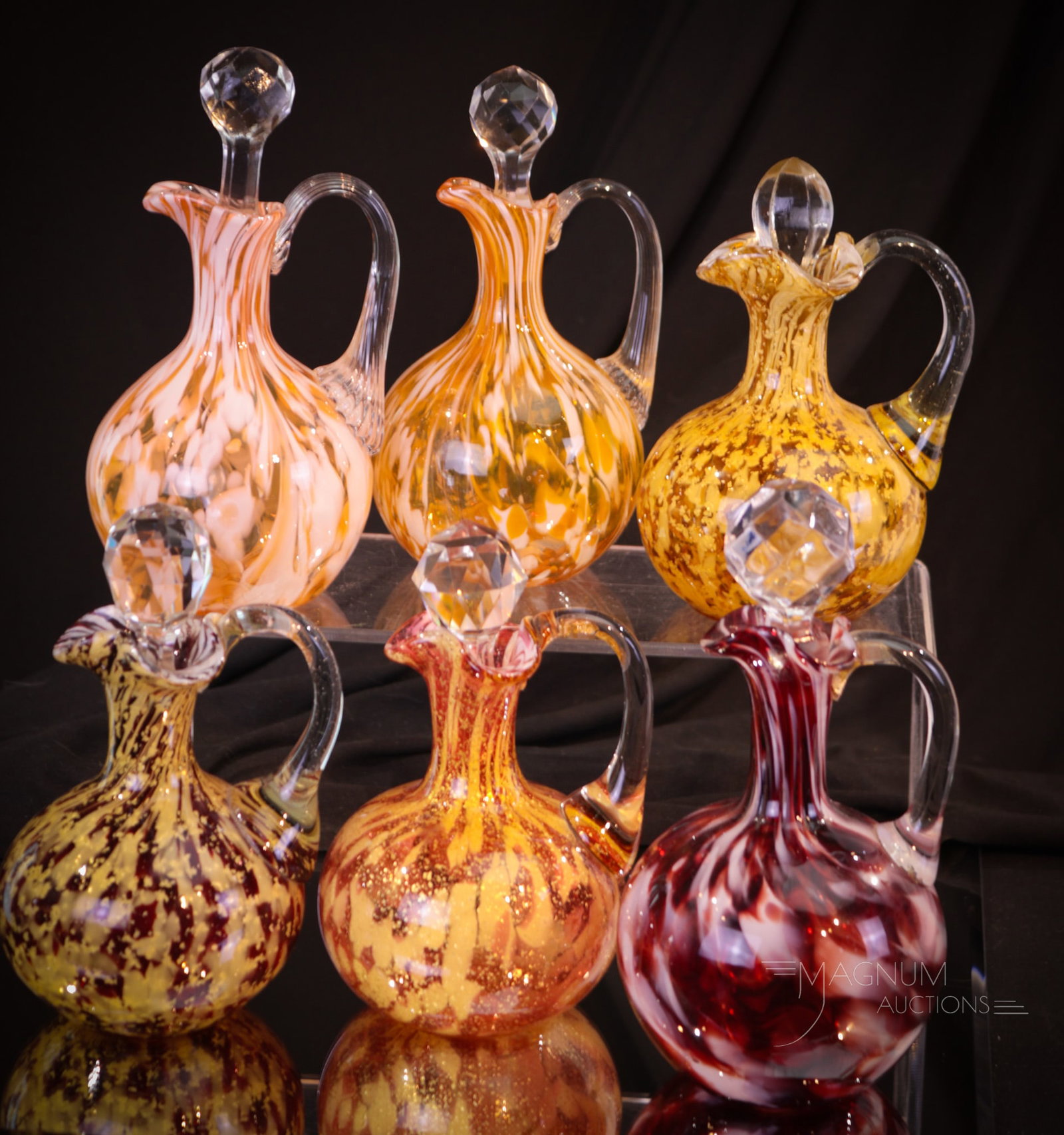 6 pc Lot Phoenix Spatter Glass Victorian Cruets: Six fine examples of Victorian attributed to Phoenix glass cruets. Each is a little different. Some feature mica inclusions. Tallest measures 7".