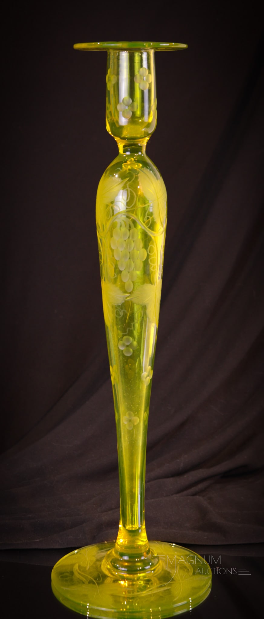 Pairpoint Vaseline Canaria Grapes 16" Candlestick: A fine single 16" tall Pairpoint vaseline Canaria color candlestick with grape etching. This is a nice offering and tough to find size. Make way on the mantle for this one!