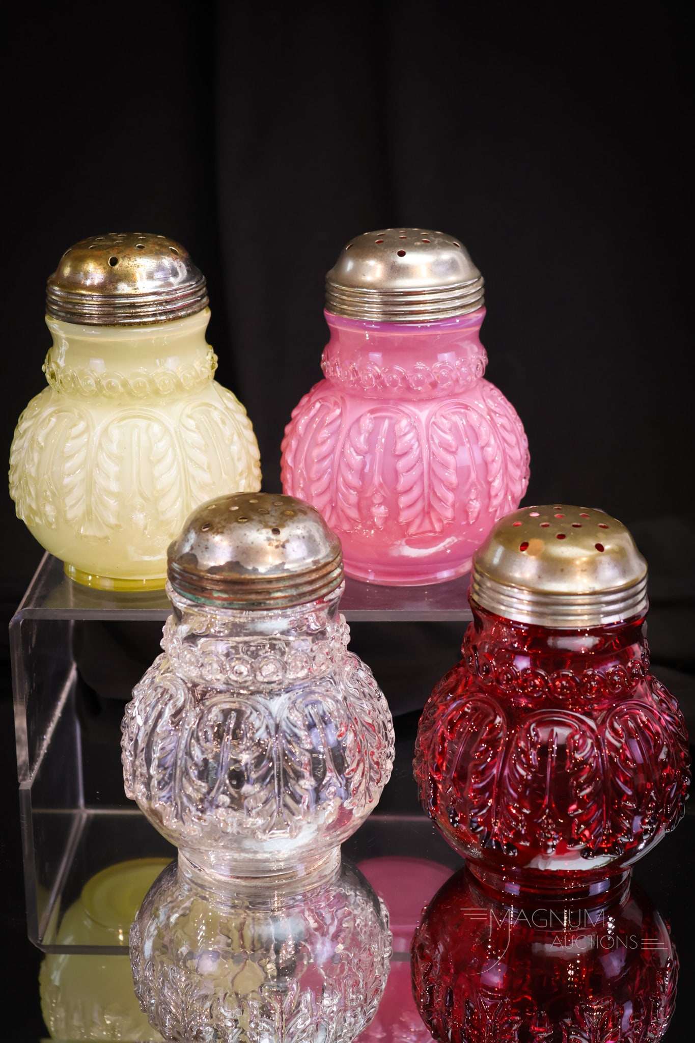 4 pc Lot Northwood Leaf Umbrella Victorian Glass Sugar Shakers: Four fine examples of Northwood's Leaf Umbrella pattern sugar shakers in various colors. Each is sure to please and definitely collection-enhancing! Each measures 4 1/2" tall.
