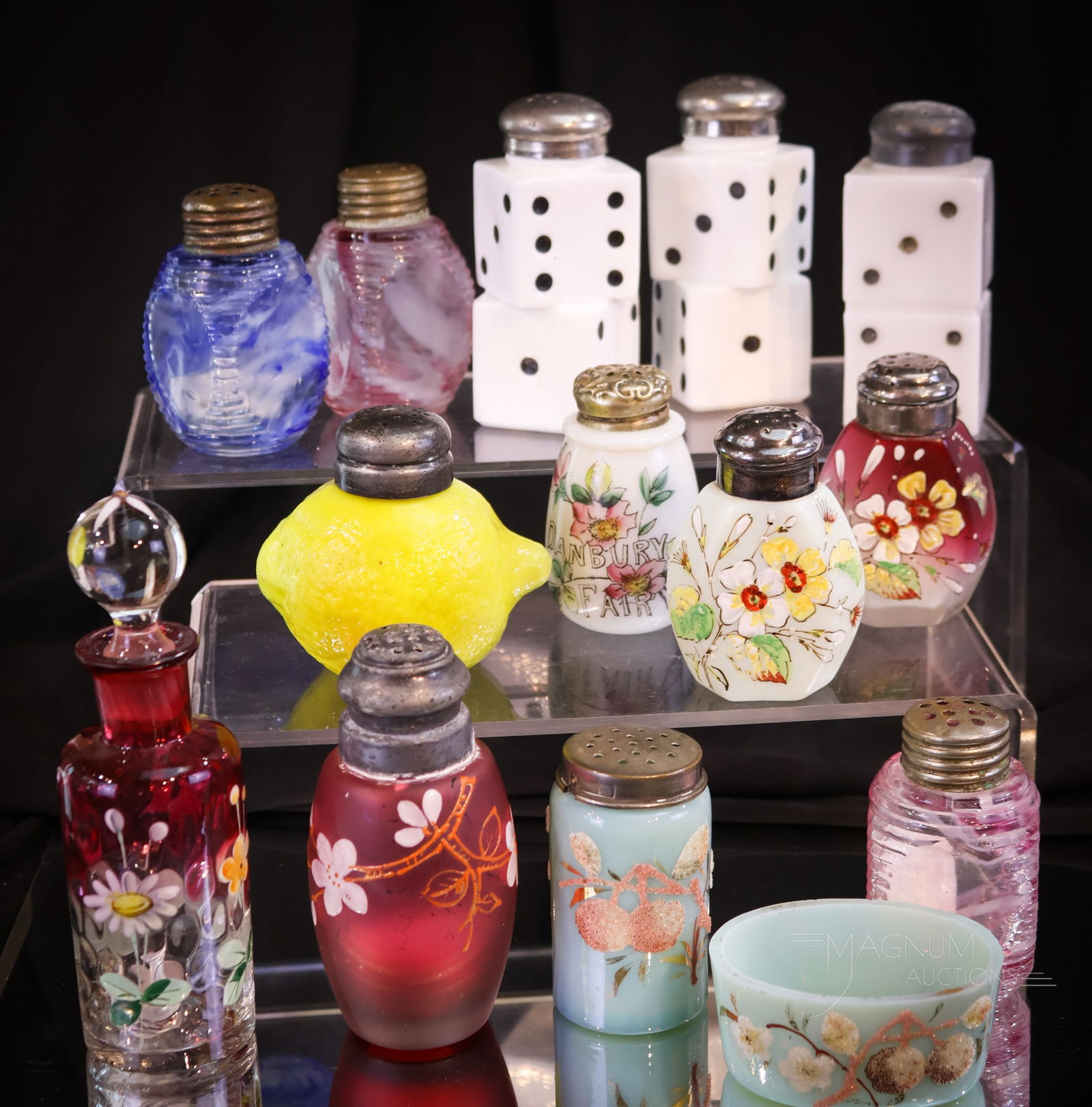 12 pc Lot Victorian Glass Salt Shakers & More: This is a lot to be sure not to miss! This lot offers so much. There is a figural lemon. Three examples of Dice shakers. Two Hexaglory pattern. A rubina decorated vinegar bottle. The offering is compl