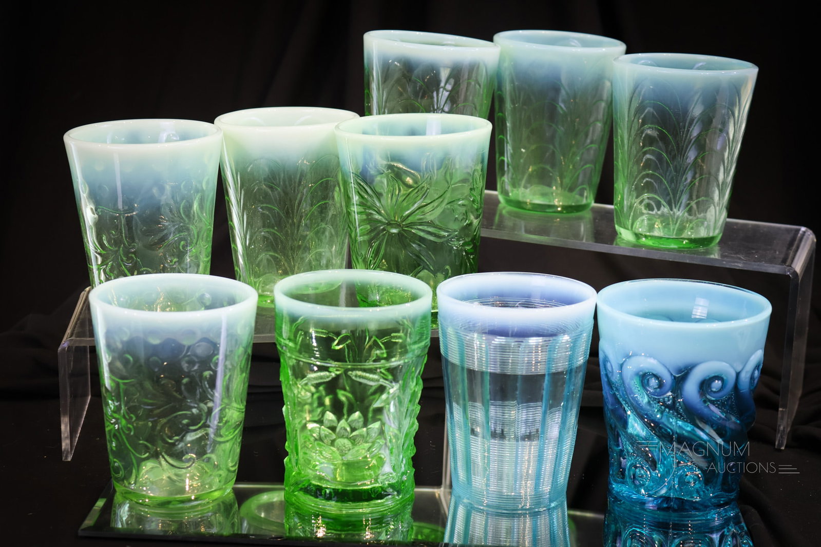 10 pc Lot Victorian & More Opalescent Glass Tumblers: Nice array of Victorian era and more tumblers in this lot. There are four green opal drapery pattern. Two green opal Buttons and Braids pattern. One green opal Poinsettia. One green opal Water Lily an