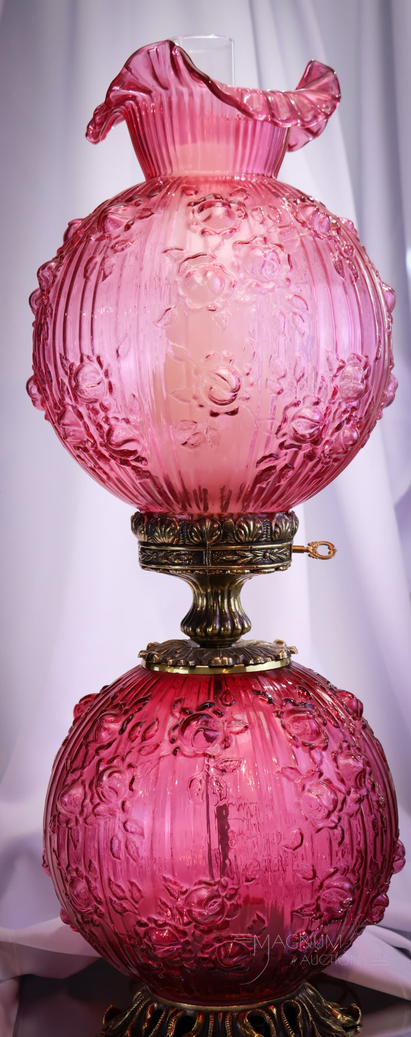 Fenton Art Glass Jumbo Country Cranberry Roses GWTW 27" Lamp: Deep coloring makes up this Fenton Art Glass Country cranberry "Roses" gone with the wind table lamp. This fine example is a must have piece! Lamp measures 27 1/2" tall.
