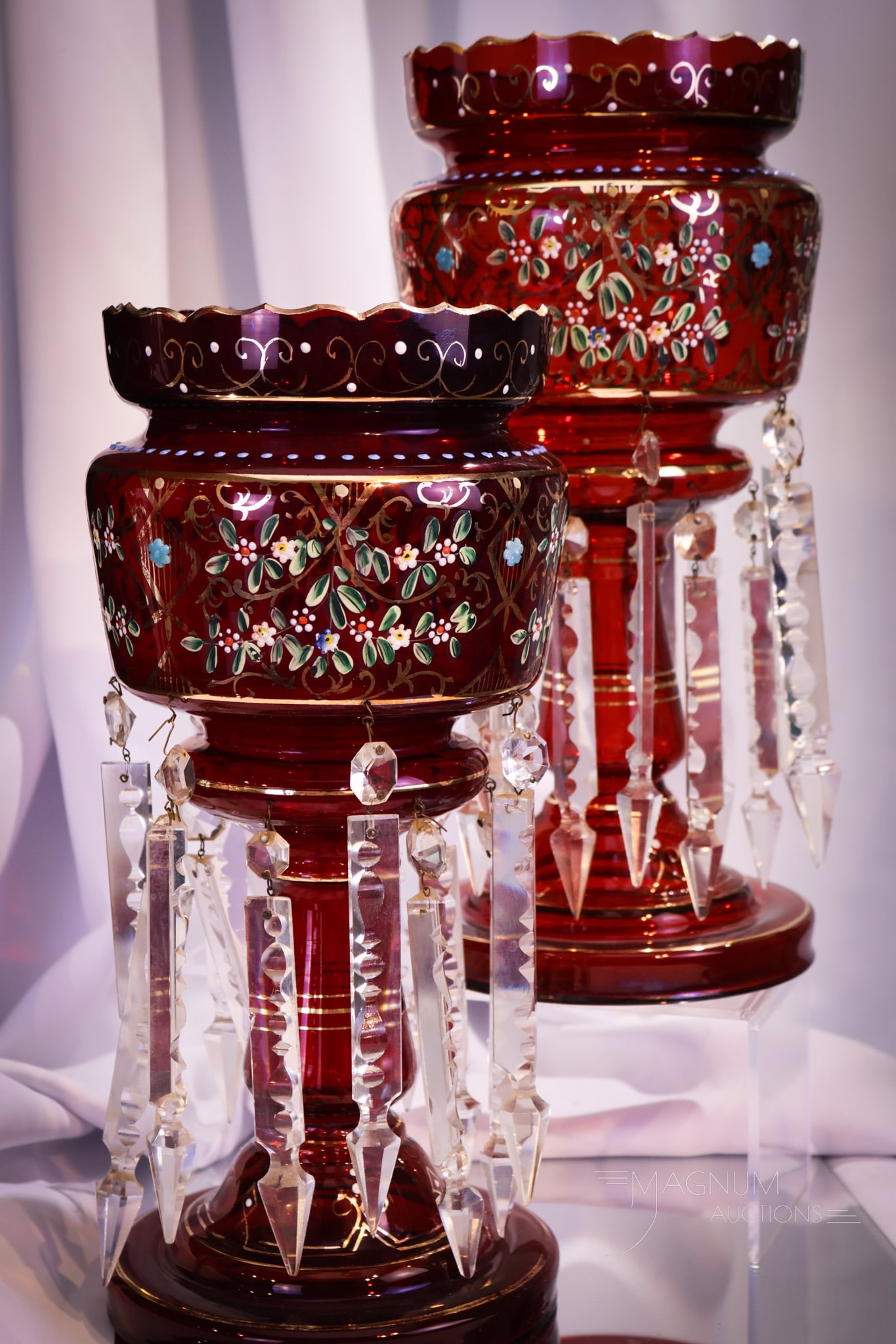Monumental 14" Pair Victorian Ruby Enameled Gilt Mantle Lusters: A stupendous pair of brilliant 14" tall Victorian mantle lusters in rich ruby glass. These are stunning. They are elaborately decorated with gilt and enameled florals.
