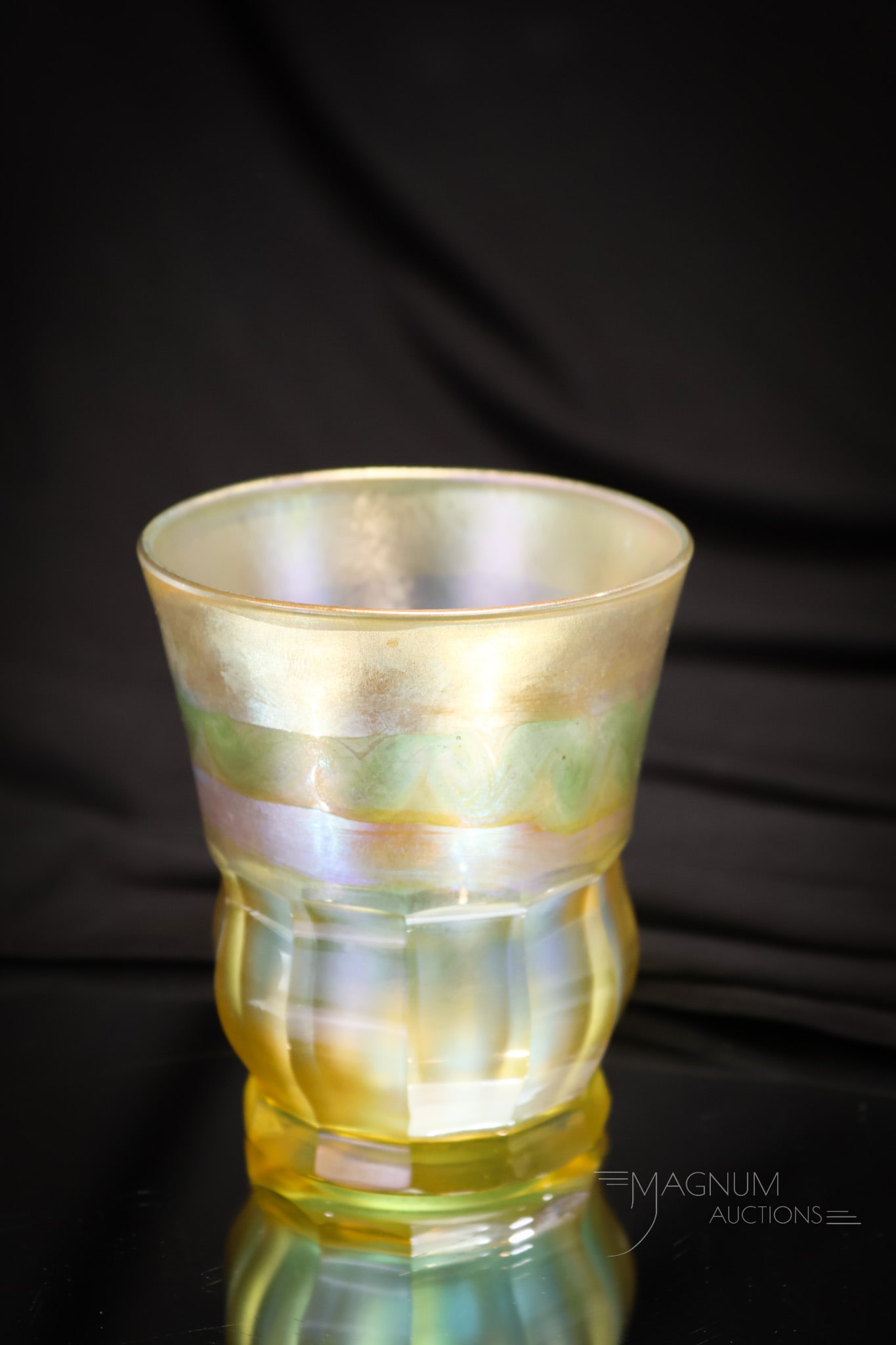 Tiffany Studios Gold Favrile Art Glass Cut Tumbler: An exquisite signed Tiffany art glass tumbler. This tumbler is complete with original paper label and is signed, "1201-LCT, Favrile." Tumbler measures 3 1/2" tall.