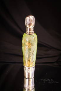 Attributed to Daum Nancy French Cameo Vaseline Victorian Glass Laydown Perfume Flask: A beautiful vaseline glass Victorian perfume glass with silver fittings. This fine piece is attributed to Daum Nancy. The lid is decorative and the perfume is complete with stopper. This piece measure