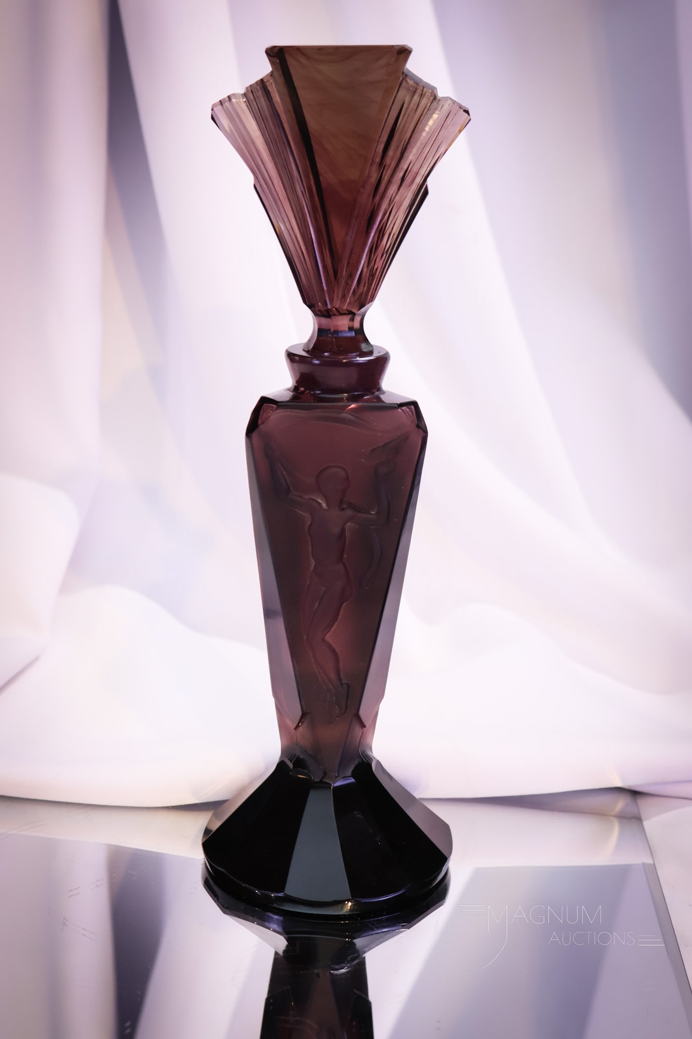 Czech Bohemian "Pesnicak" Art Deco Nude Amethyst 11 1/2" Perfume Bottle: Here's a wonderful Czech Bohemian glass "Pesnicak" Art Deco Nude Perfume bottle. This piece measures 11 1/2" tall. It is in amethyst glass with satin panels of nudes dancing.