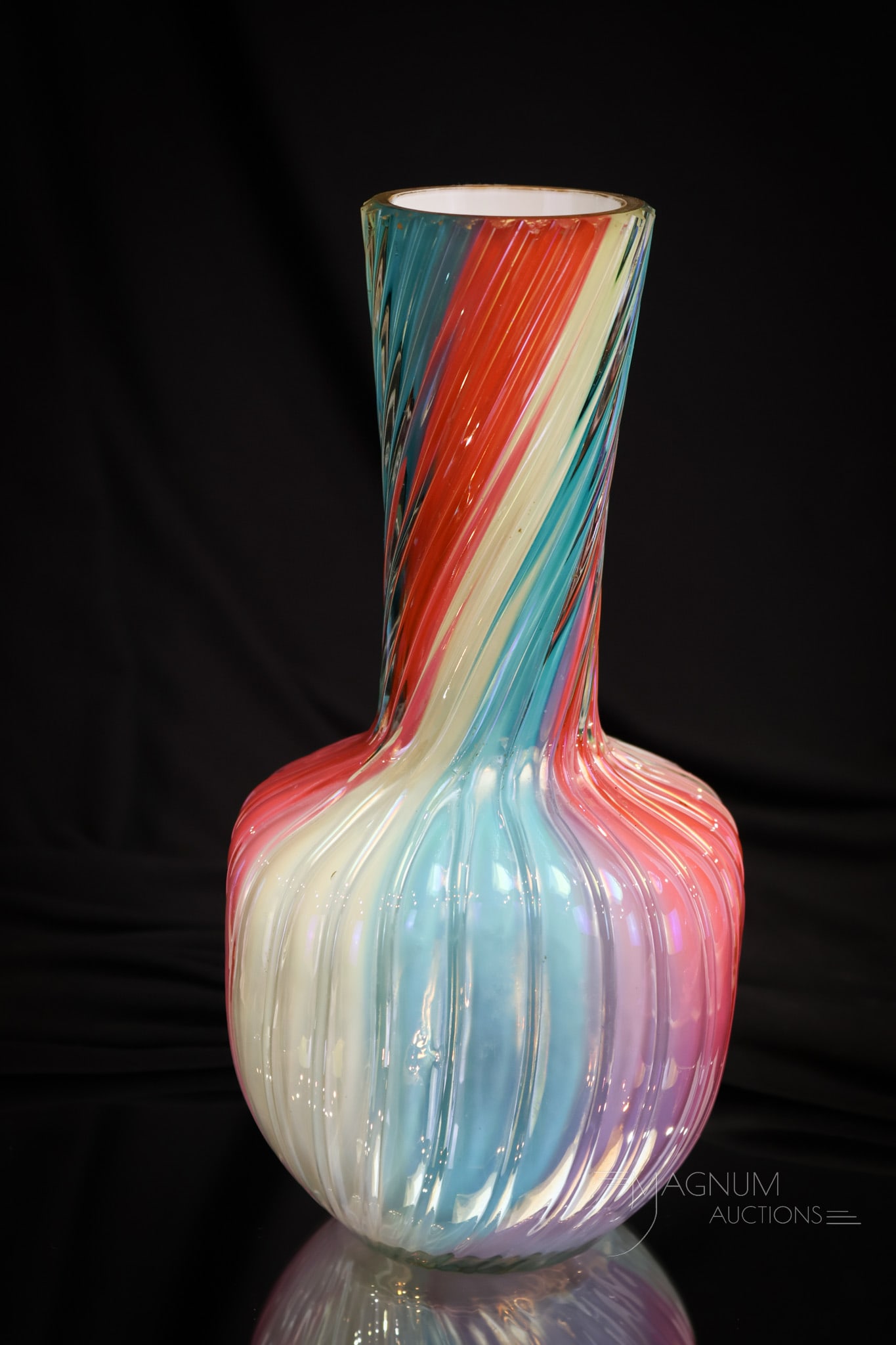 Loetz Victorian Rainbow Uranium Art Glass 10" Vase: Another fine find in Loetz rainbow uranium-rich art glass. This vase measures 10" tall. It features a gold decorated rim and pinched sides. A beautiful example.