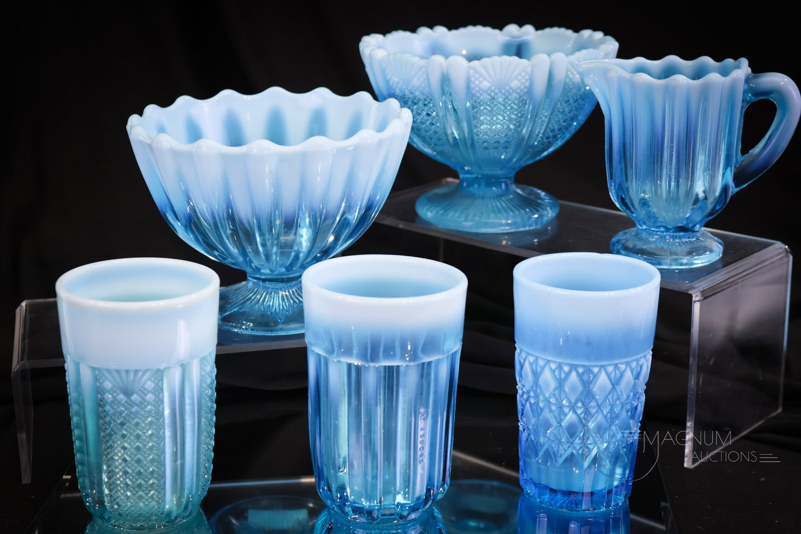 6 pc Lot Davidson Victorian Opalescent Glass: Six finds in Victorian Davidson glass. These are all in blue opalescent glass. There are three tumblers, a creamer, and two compotes for your bidding pleasure. The tallest of the lot measures 4 1/2".