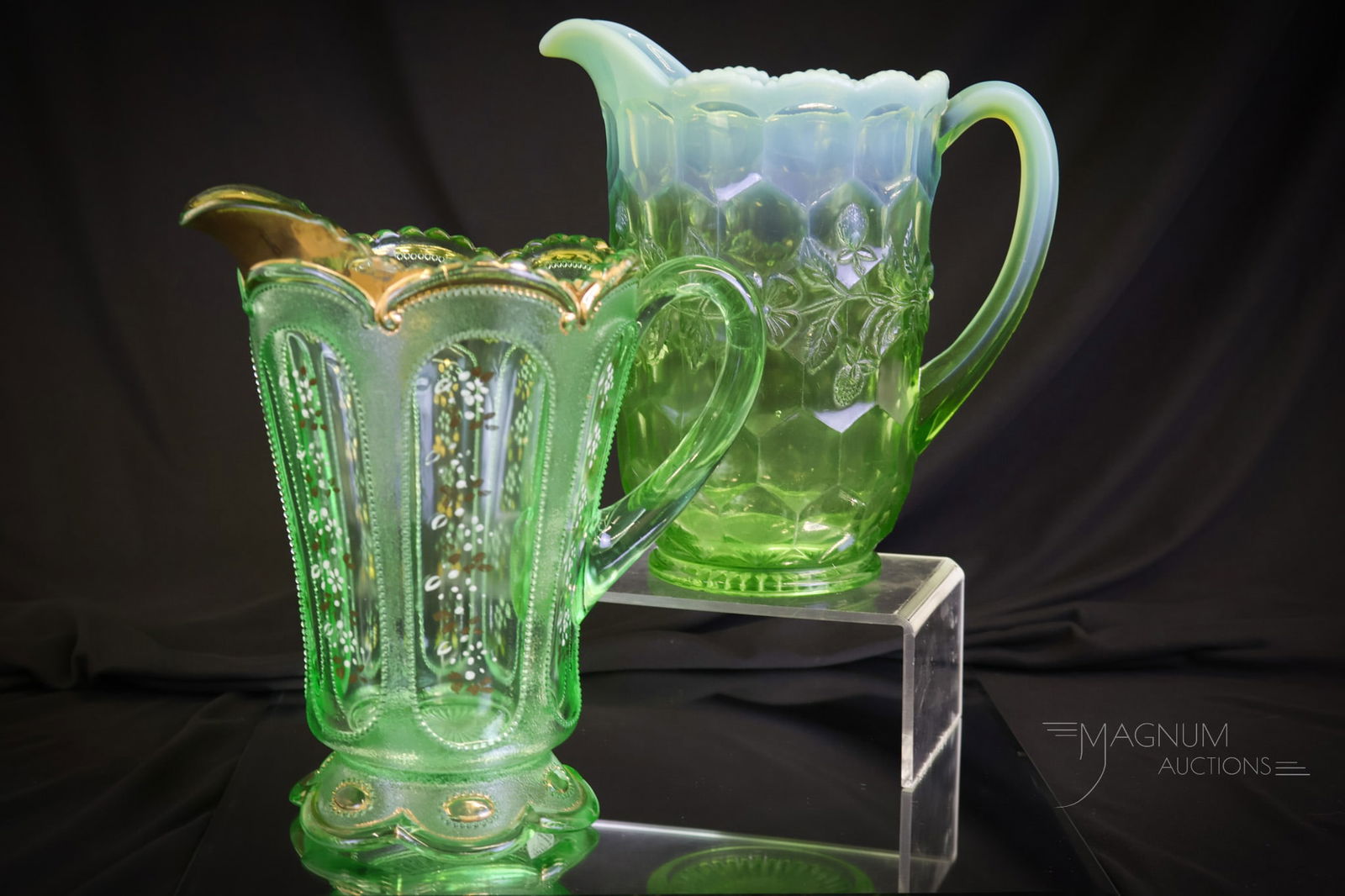 2 pc Lot Green Opalesent Victorian Glass Water Pitchers: Two superb examples of Victorian glass water pitchers in green opalescent with decoration. The first is a Honeycomb and Clover example. The second is a Beaded Ovals in the Sand example. The largest me