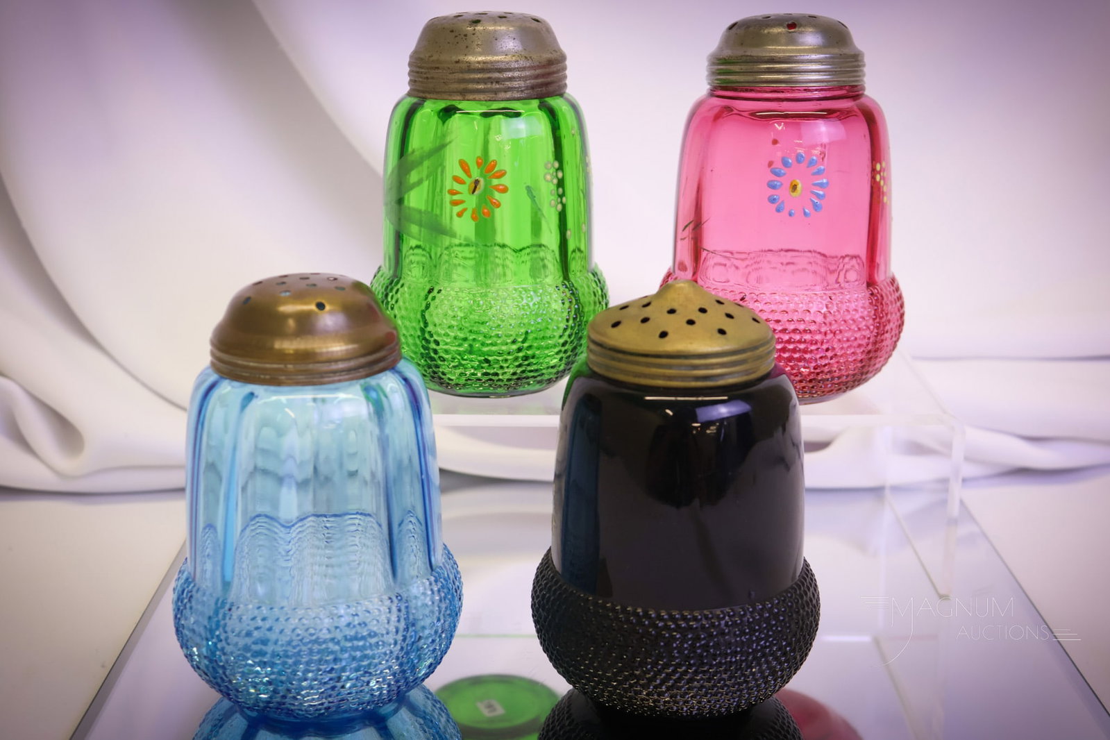4 pc Lot Victorian Glass Acorn Sugar Shakers Cranberry Blue Green & More: Four highly collectible Victorian sugar shakers in the Acorn pattern. This lot offers a scarce cranberry, a green, a black and a blue. All are decorated except for the blue. Lovely! Each measures 5"" 