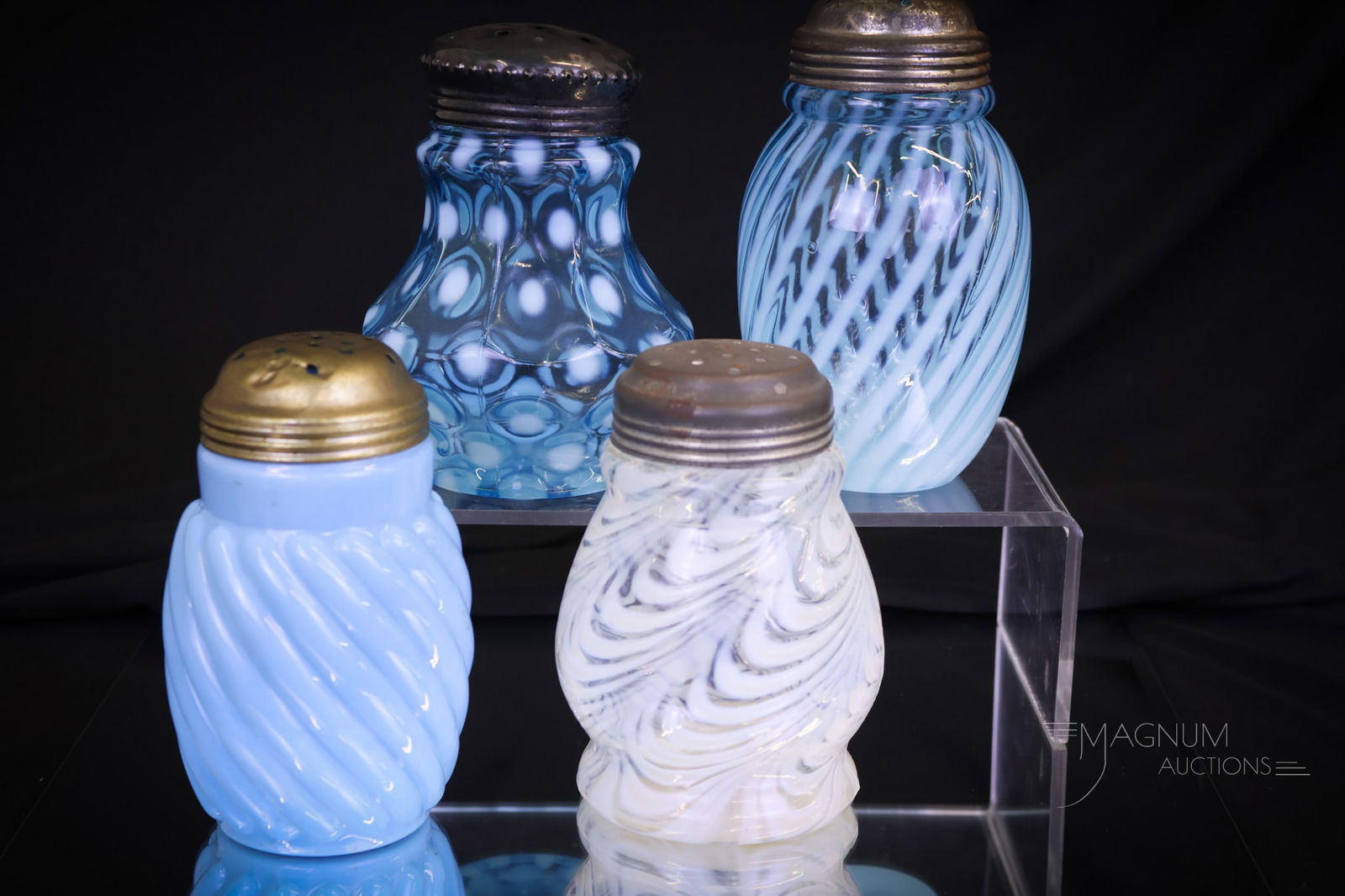 4 pc Lot Victorian Opalescent & More Glass Sugar Shakers: Four fine examples of Victorian glass sugar shakers. This lot includes a blue opaque Reverse Swirl pattern, a Blue opalescent Coinspot, a whtie opal Blown Twist pattern, and a blue opalescent swirl. T