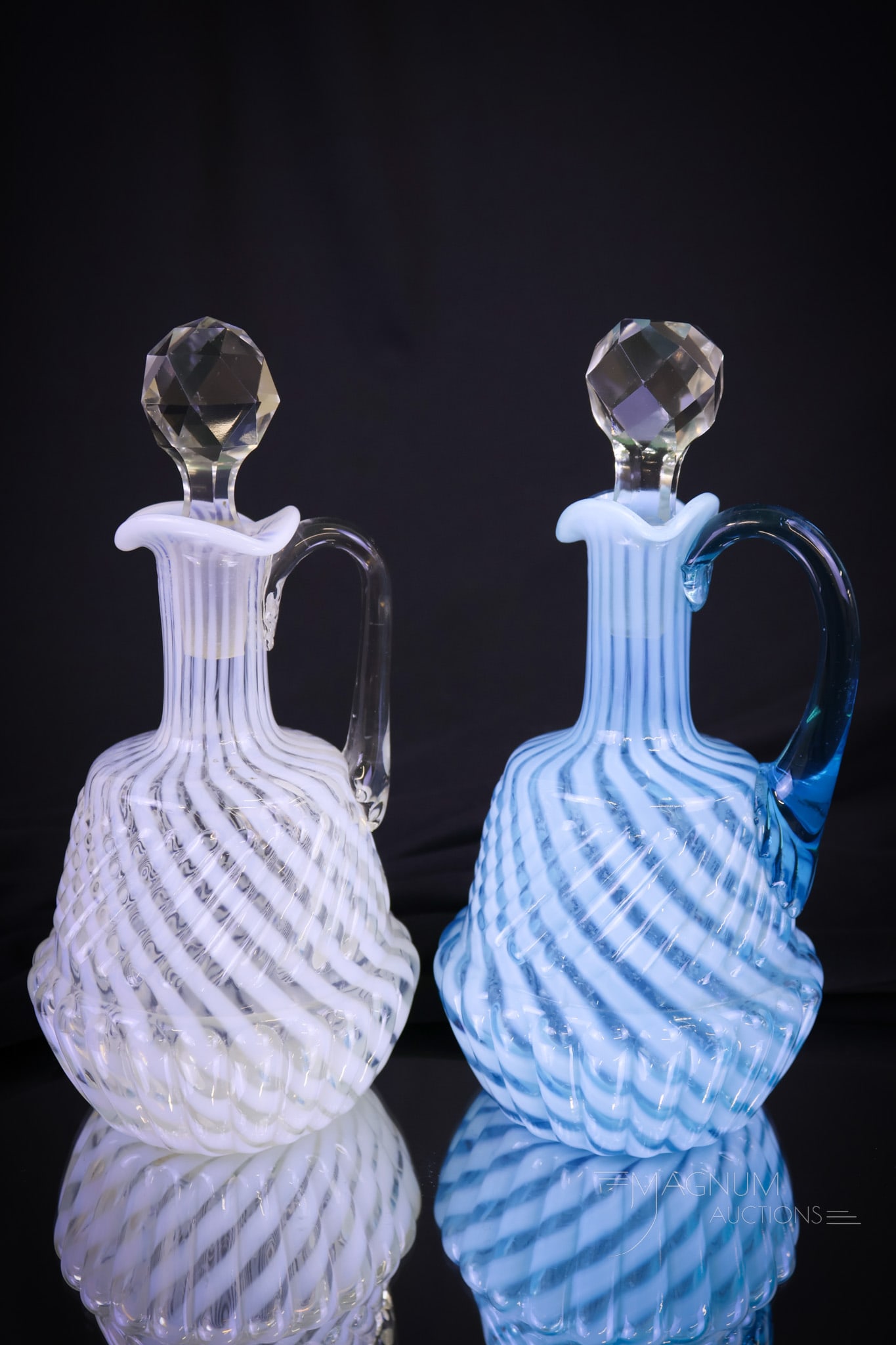 2 pc Lot Northwood Chrysanthemum Base Swirl Victorian Opalescent Glass Cruets: Two Northwood opalescent Victorian glass cruets. One in blue, and one in white opal. Both are in the Chrysanthemum Base Swirl pattern. Each measures 7"" tall and 3 1/4"" wide. Shipping: At checkout,