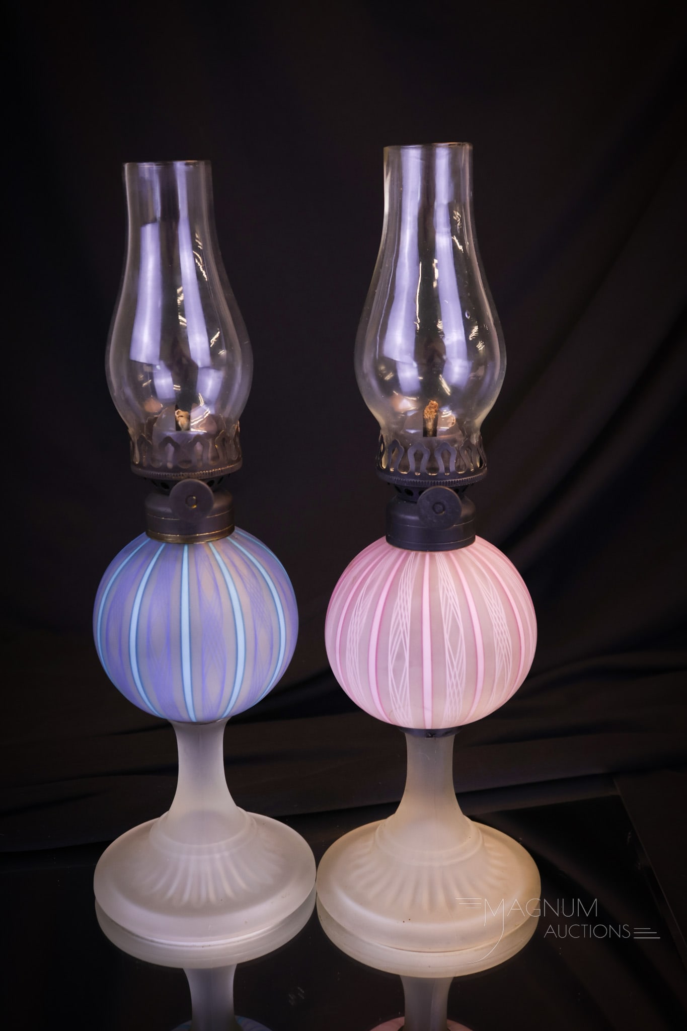 2 pc Lot Italian Murano Latticino Art Glass Miniature Oil Lamps: Two distinct examples of Italian Murano Latticino art glass miniature oil lamps. One in pink and one in blue. Great hard to find examples! The tallest measures 7 1/4"" tall to the burner collar. Shipp