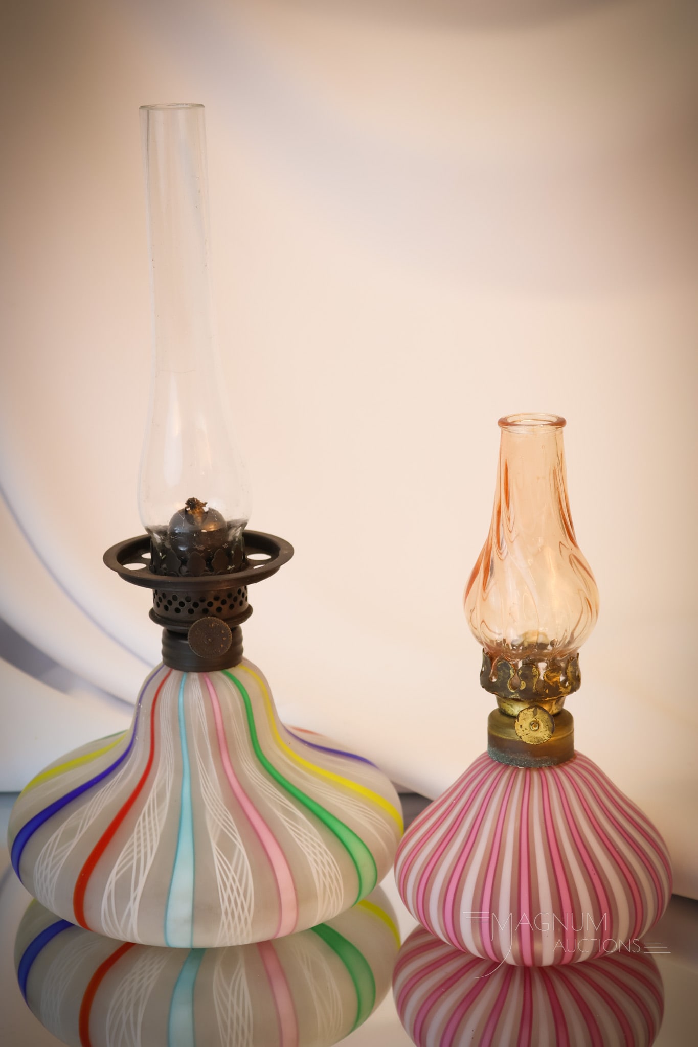 2 pc Lot Miniature Italian Murano Latticino & Millefiori Art Glass Oil Lamps: A fine offering of two unique Italian Murano art glass miniature oil lamps. One in Latticino and one in rainbow Millefiori glass. The tallest measures 4"". Shipping: At checkout, select ""Arrange your