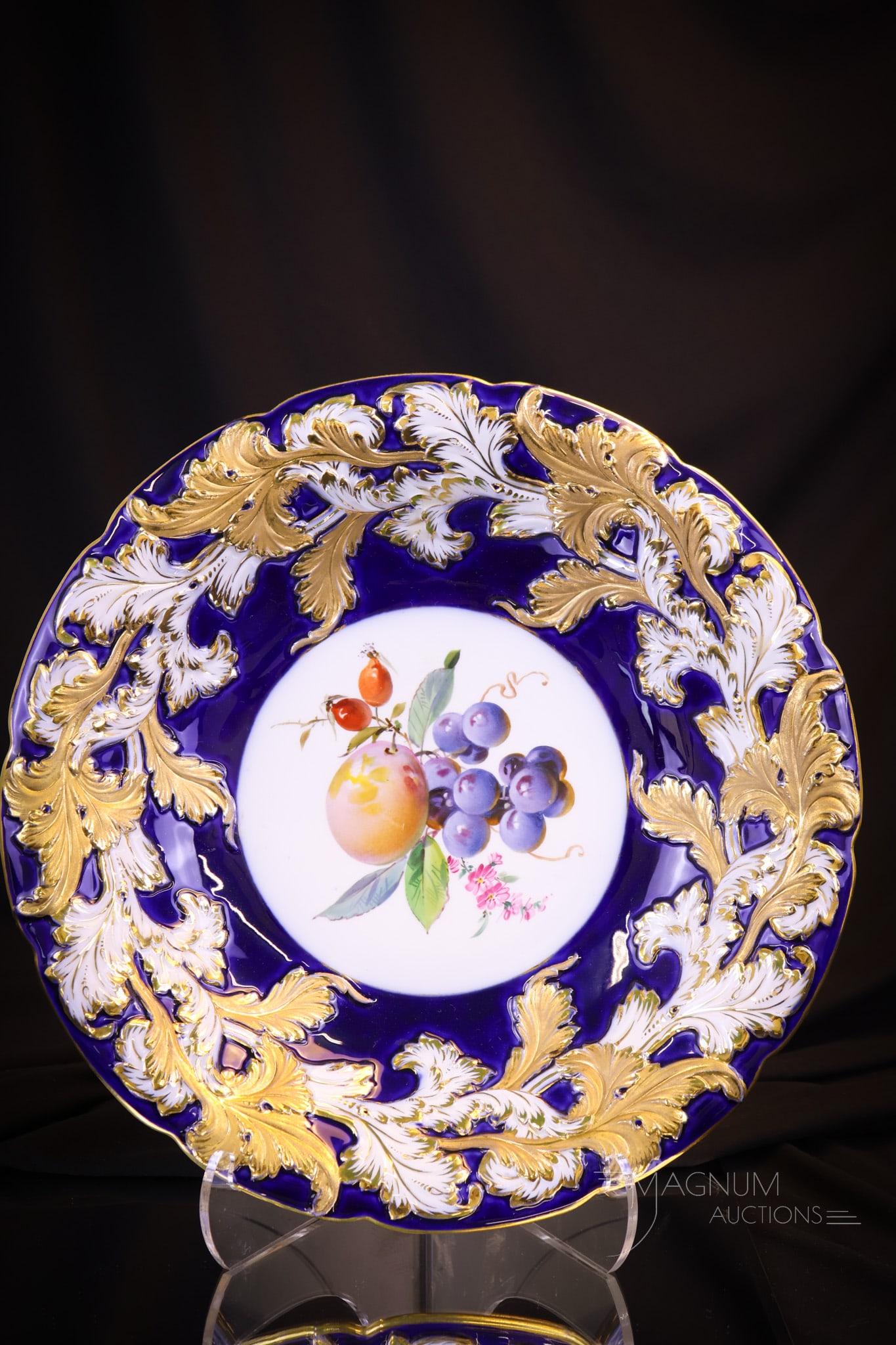 Meissen Cobalt Blue Porcelain fruits Bowl: A lovely Meissen cobalt blue with gold and white leaf border bowl with fruits design in the center. The bowl measures 2"" tall and 12"" in diameter. Shipping: At checkout, select ""Arrange your own sh
