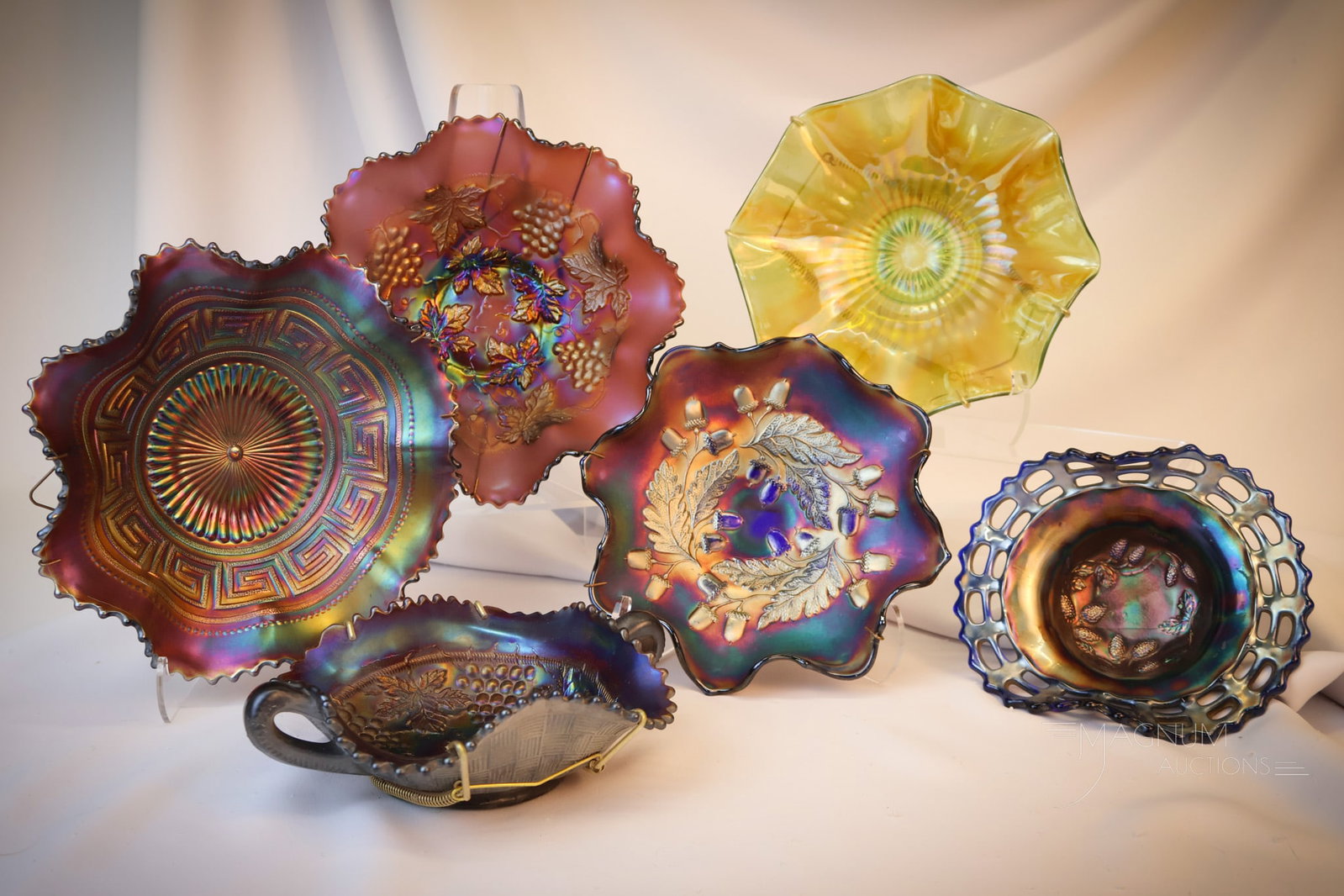 6 pc Lot Northwood & Fenton Carnival Glass: Six fine examples of Northwood & Fenton carnival glass. This lot includes five bowls and a bon-bon. Largest measures 2 1/2"" tall Shipping: At checkout, select ""Arrange your own shipping"". For a