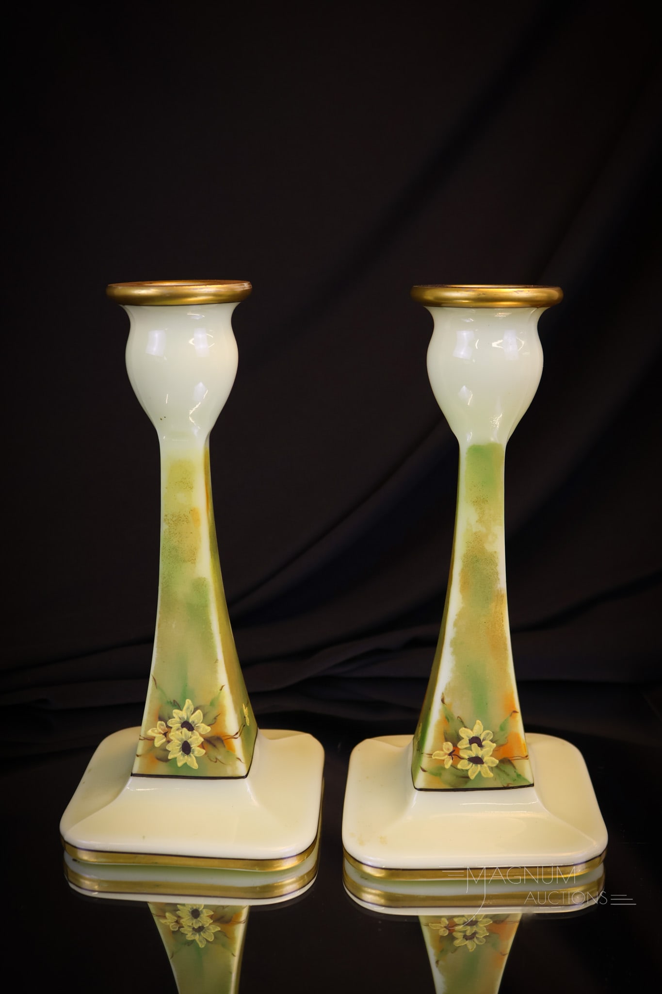 Cambridge Ivory Uranium Glass Enameled & Gilt Candlesticks: Here's a desirable find! This is a pair of Cambridge Glass Ivory gilt and enamel decorated candlesticks in uranium-rich glass. This pair is very nice and very collection enhancing! Each measures 7 3/4