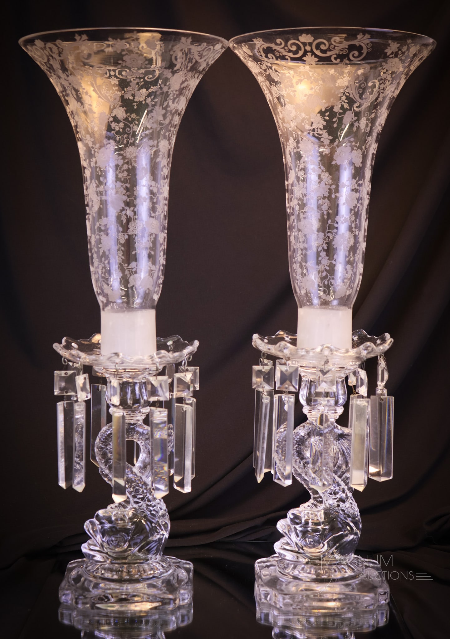 Pair CambridgeGlass Dolphin Chantilly Etched Hurricane Candleabrum: A beautiful pair of Cambridge clear glass dolphin candleabrum. Each with boboches with prisms and Chantilly pattern etched hurricane shades. Each measures 18 1/4"" tall. Shipping: At checkout, select 