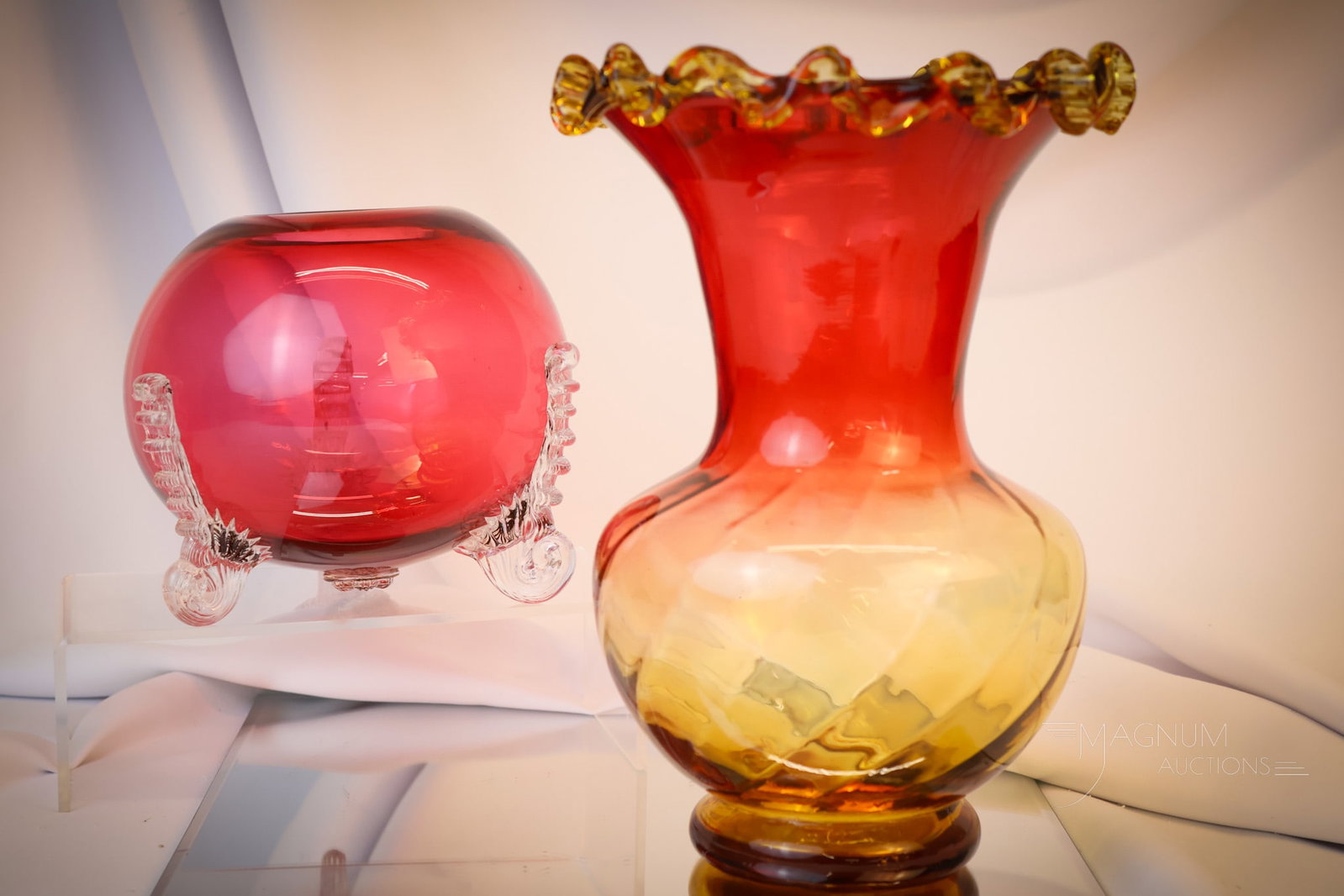 2 pc Lot Hobbs Bohemian Victorian Glass: Two fine examples of Victorian art glass. This lot includes a Hobbs Neapolitan cranberry rose bowl and a Bohemian amberina ruffled rim vase with applied amber rim. The tallest measures 10 1/2"". Shipp
