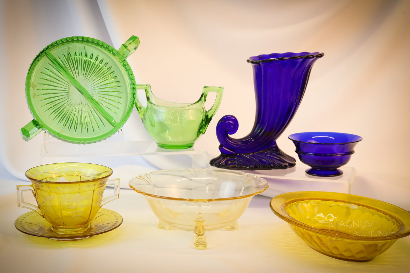 8 pc Lot Heisey Collectible Glass: Eight fine pieces of Heisey collectible glass in various patterns and colors, and forms. Something that will surely please is found in this fine offering. The tallest measures 7 1/4"" tall. Shipping: 