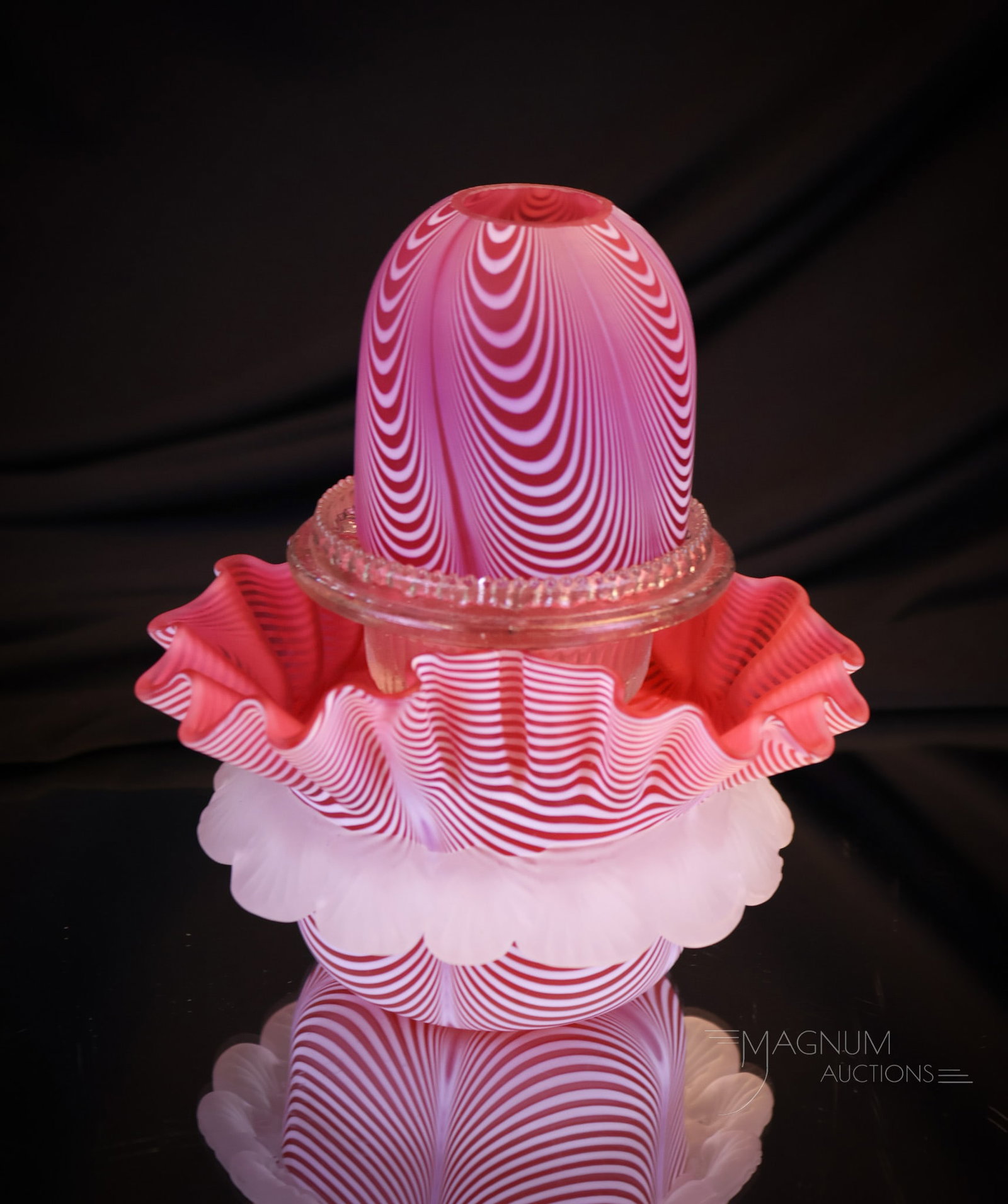 Cranberry Nailsea Victorian Glass Fairy Lamp: A very nice Victorian cranberry nailsea fairy lamp. This one with a triangular base with applied rigaree and clear Clarke's insert. This fairy lamp measures 6" tall and 5" wide. Shipping: At checkout,