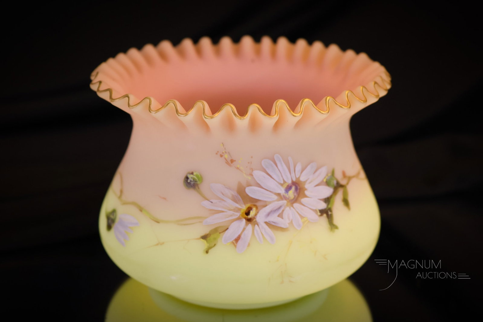 Mt. Washington Victorian Burmese Glass Decorated Finger Bowl: A beautiful and rarely found piece of Mt. Washington glass. This is a finger bowl in burmese glass. The bowl features a tightly crimped top rim and a floral band of daisies around the waist. The bowl 