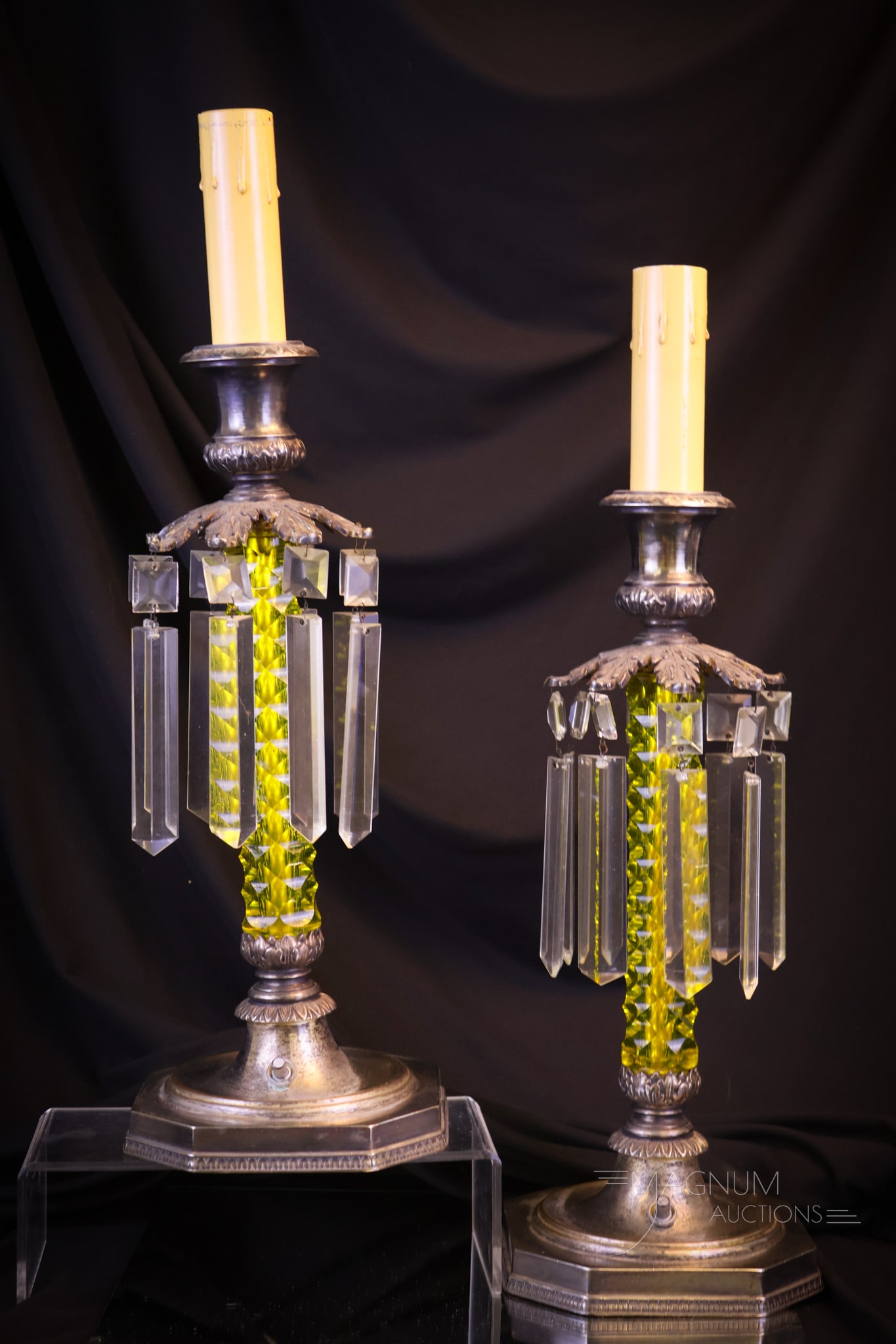 Pair Pairpoint Cut "Canaria" Vaseline Glass Candlestick Lamps: A fine pair of cut Canaria color Pairpoint vaseline candlestick lamps. Each with marked silverplate fittings and clear prisms. Each lamp measures 18 1/2" tall and 5 1/2" wide. Shipping: At checkout,