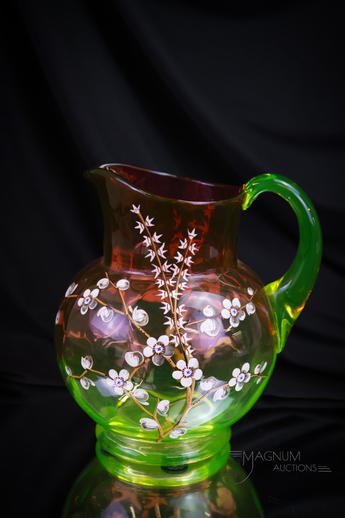 Cranberry Vaseline Victorian Enameled Glass Water Pitcher: A wonderful find in Victorian glass. This is a Rubina Verde cranberry to Vaseline pitcher with enameled flowering branches. The pitcher measures 8" tall and 7" wide. Shipping: At checkout, select "Arr