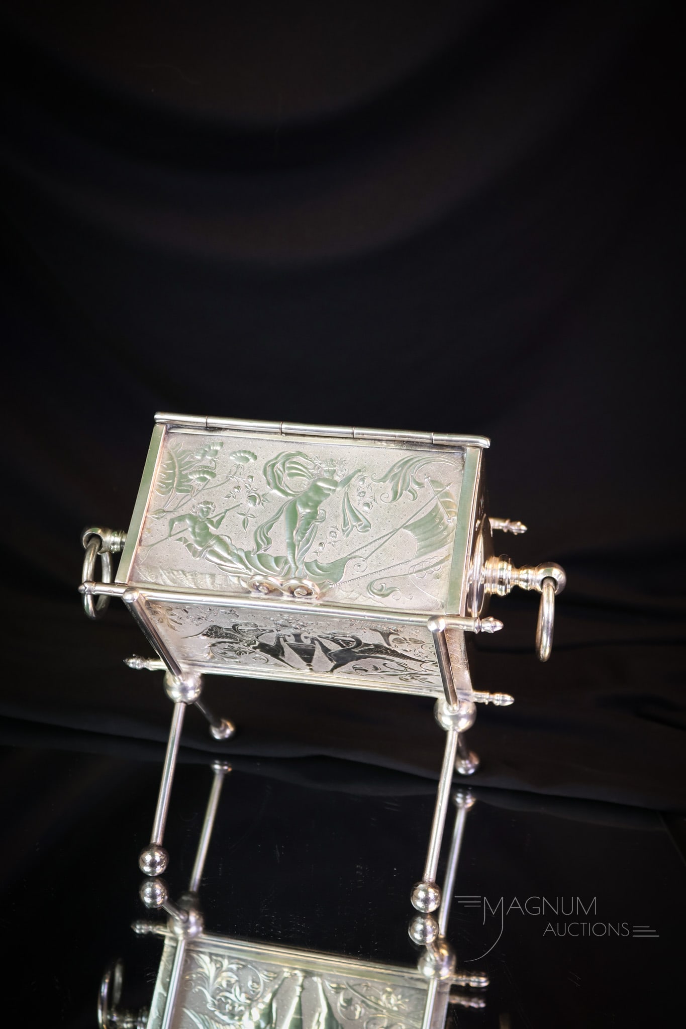 Victorian Silverplate Jewelry Casket Dated 1878: A fine four-legged Victorian Jewelry casket. This superb example is dated "1878" and engraved with the name "Ella." The casket measures 5 1/2" tall and 6" wide. Shipping: At checkout, select "Arrange 
