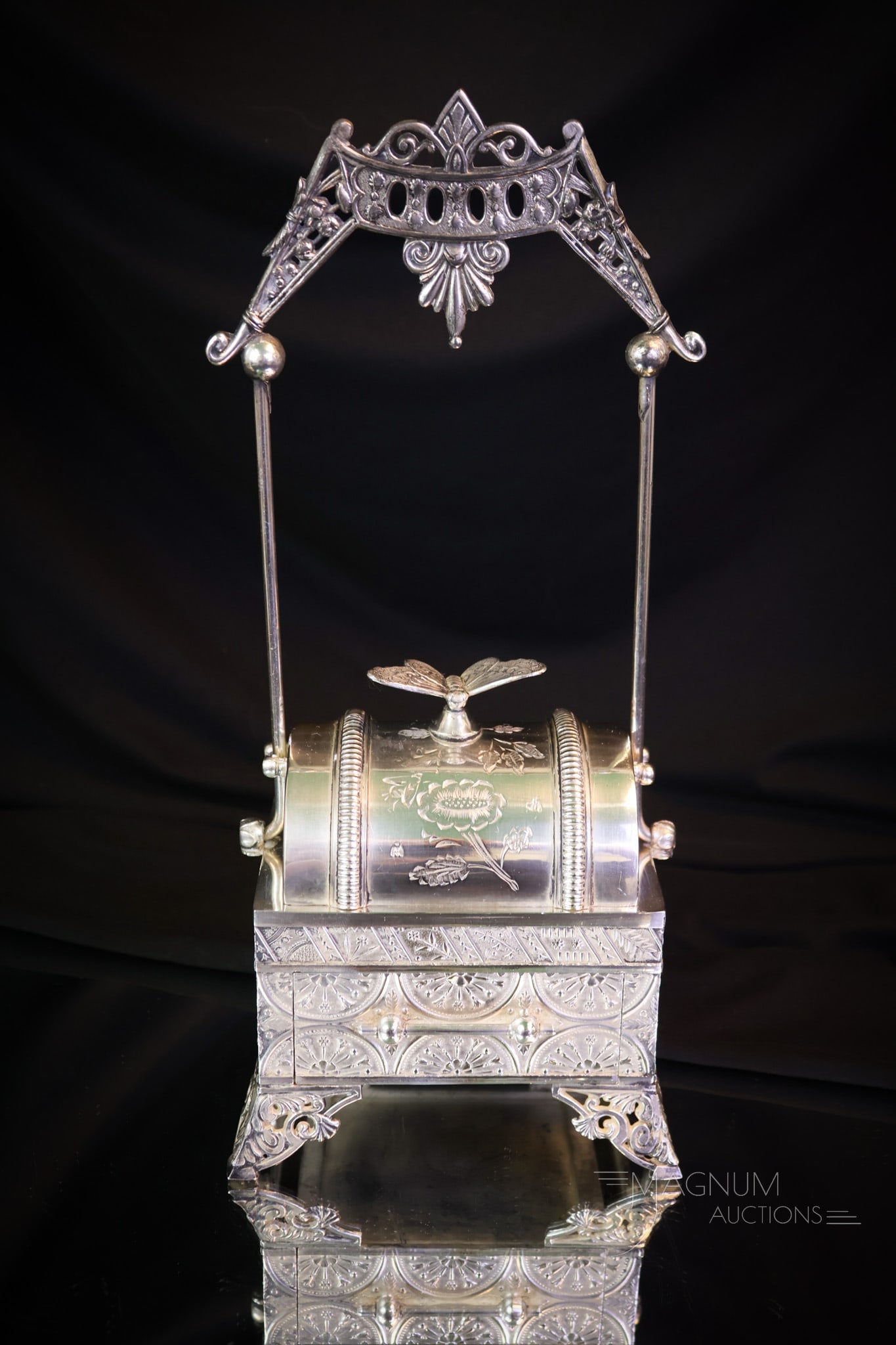 Webster Silverplate Mechanical Jewelry Casket: A beautiful find in a mechanical Victorian silverplate jewelry casket. This fine piece is signed Webster silverplate. This one has a butterfly finial on the top lid and a movable handle. The jewelry c