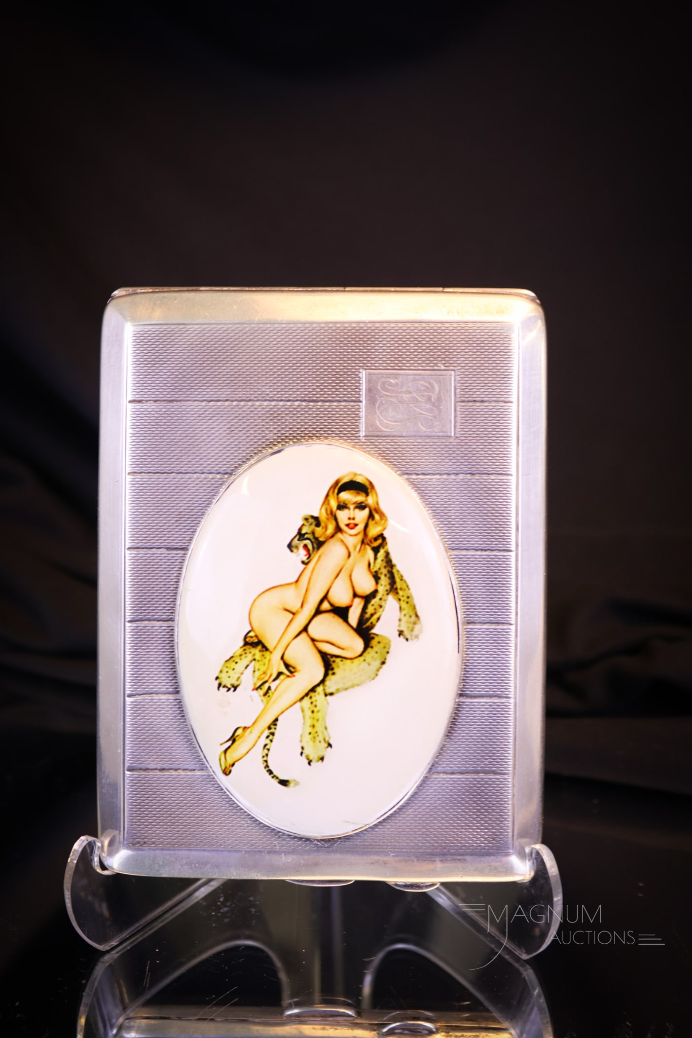 English Sterling Silver Hallmarked Monogrammed Nude Enameled Cigarette Case: Another fine sterling silver hallmarked cigarette case. This piece is also monogrammed. The case has an applied plaque of a nude lady on a cheetah rug. Hallmark indicates 1918-1925, and most likely us