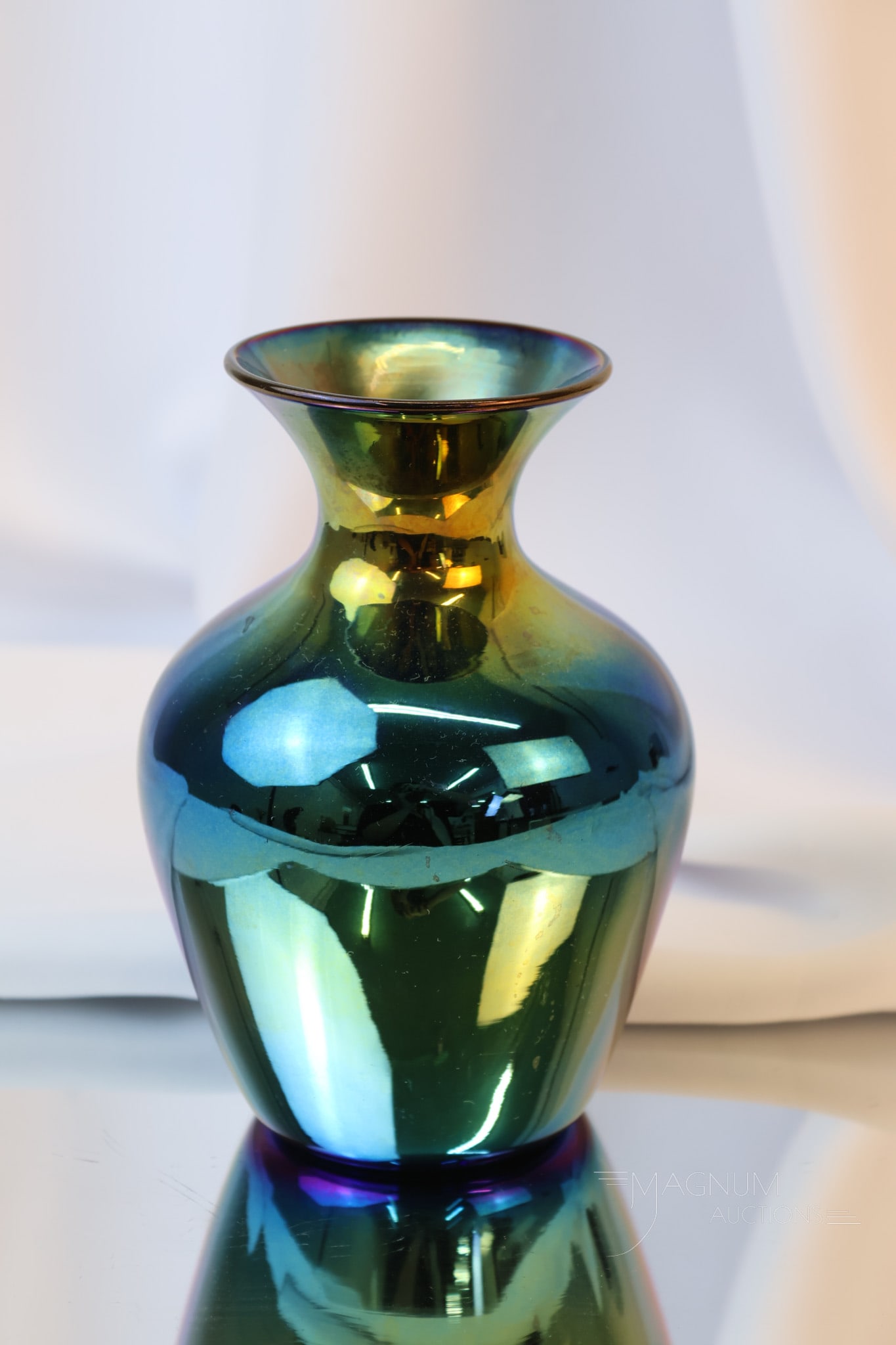 Imperial Lead Lustre Freehand Iridescent Art Glass Vase: A beautiful example of Imperial Freehand Lead Lustre blue iridescent art glass. This vase measures 6 1/2" tall and 4" wide. Shipping: At checkout, select "Arrange your own shipping". We pack & ship al
