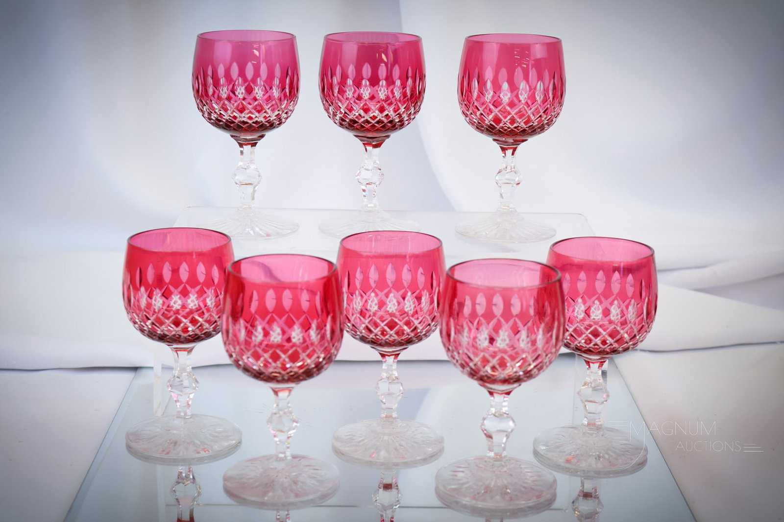 8 pc Set Cranberry Cut Glass Wine Stems: Eight stems make up this set of cranberry cut to clear wines. Each measures 4 1/4" tall and 2 1/4" wide. Shipping: At checkout, select "Arrange your own shipping". We pack & ship all items in house.<